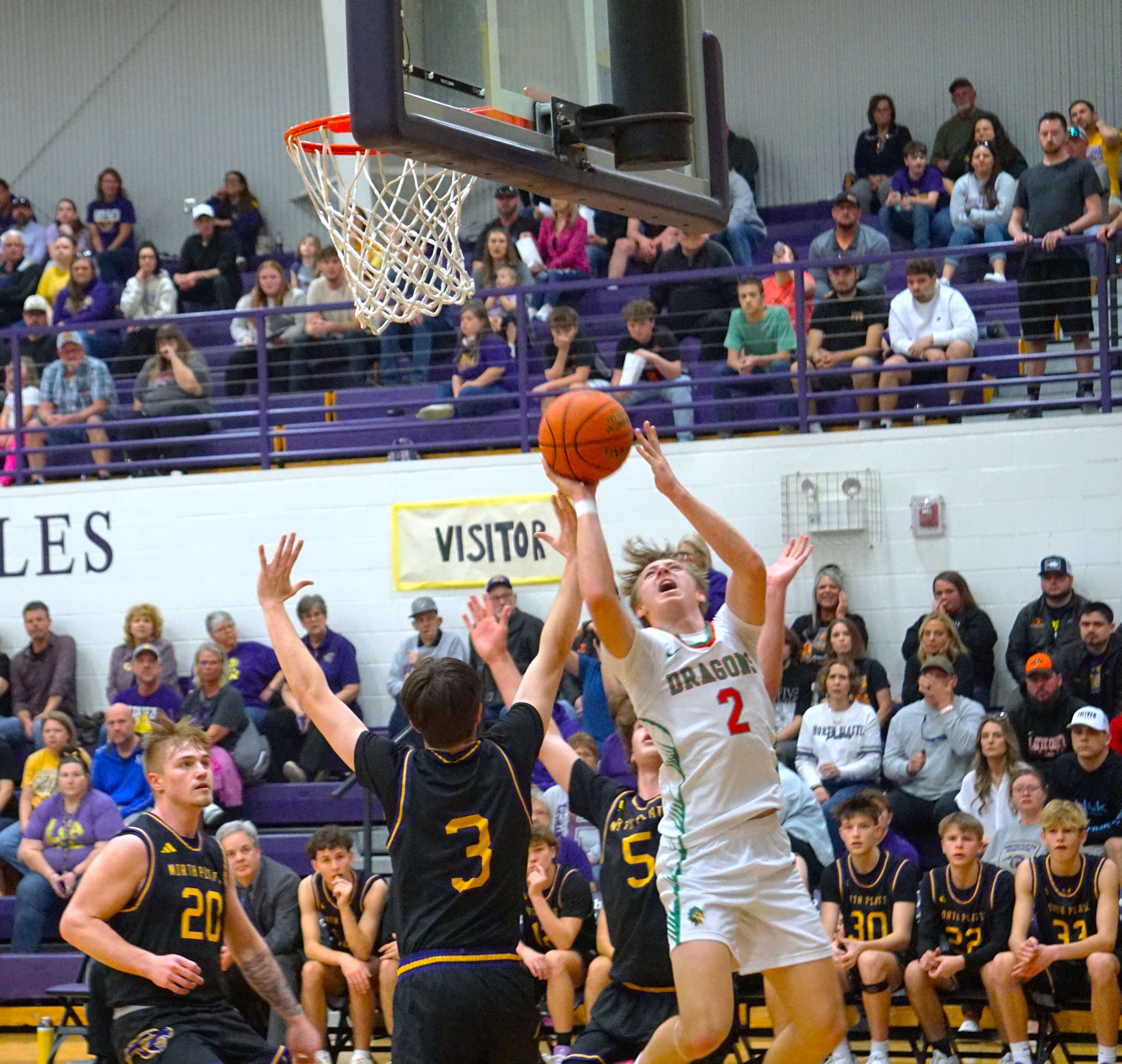 Raife Smith (2) goes for the contested shot against Hunter Palmer (3)/Photo by Matt Pike