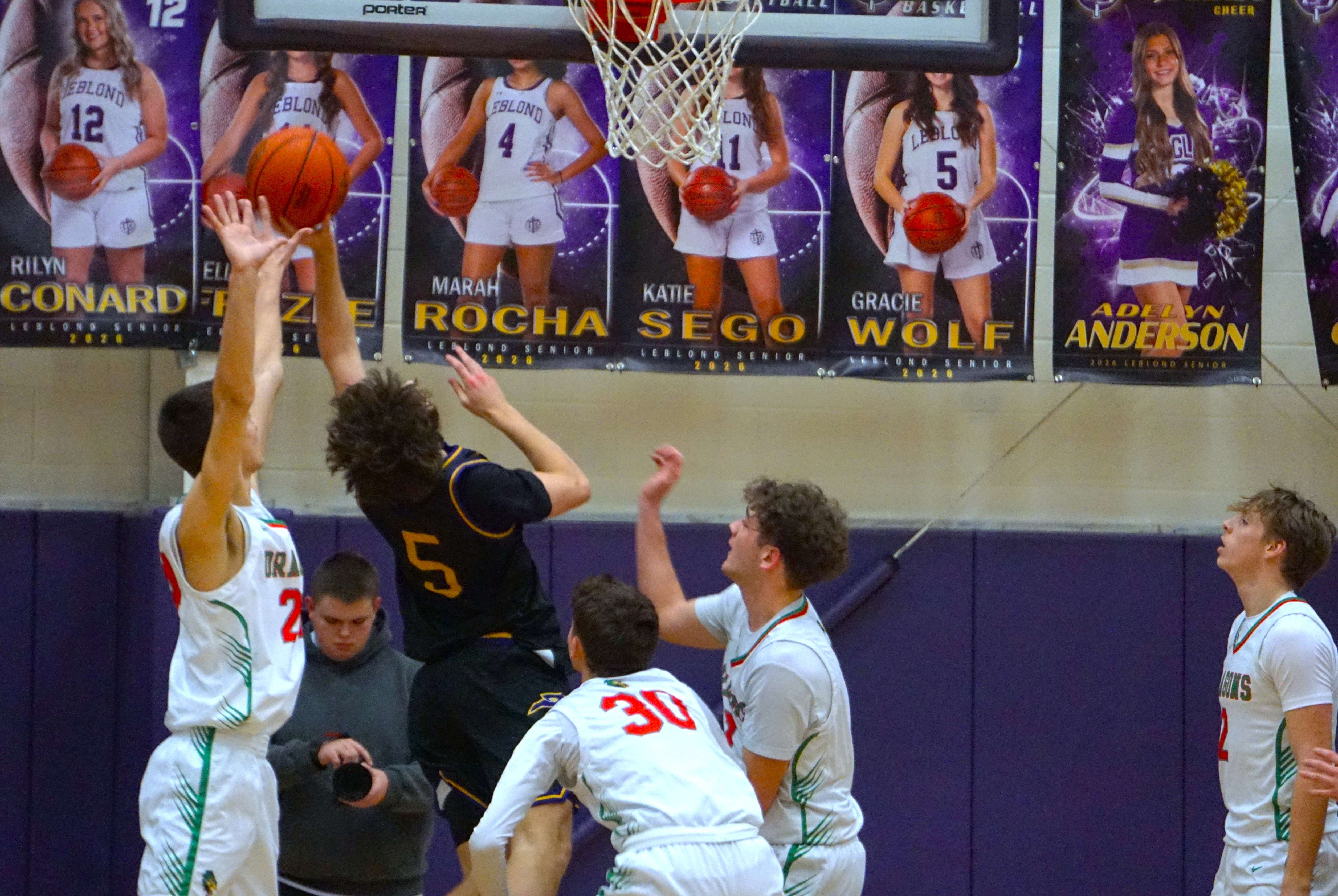 Brenden Matt (5) drives the lane/ Photo by Matt Pike