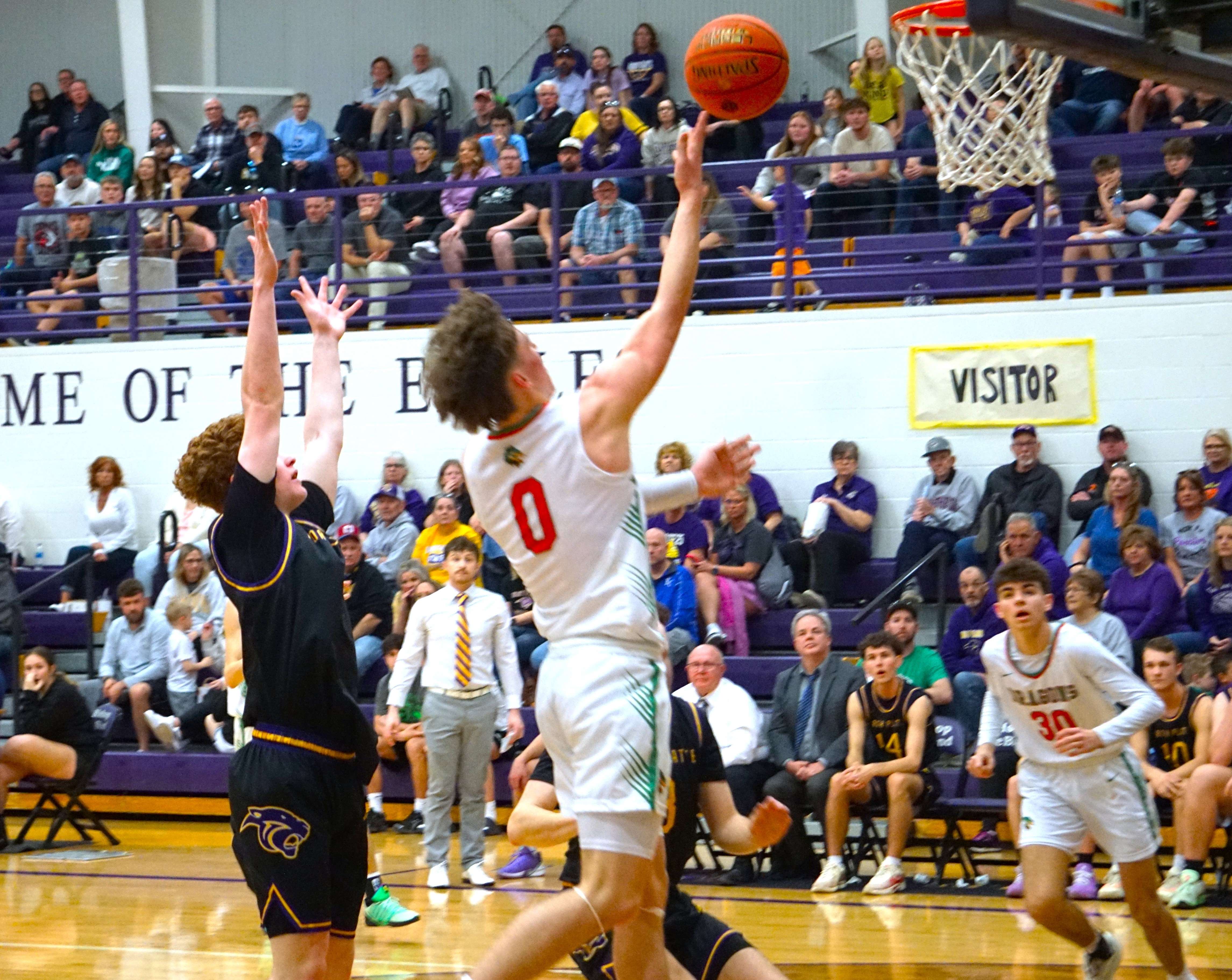 Chris Kowalewycz (0) drives in for the layup/ Photo by Matt Pike