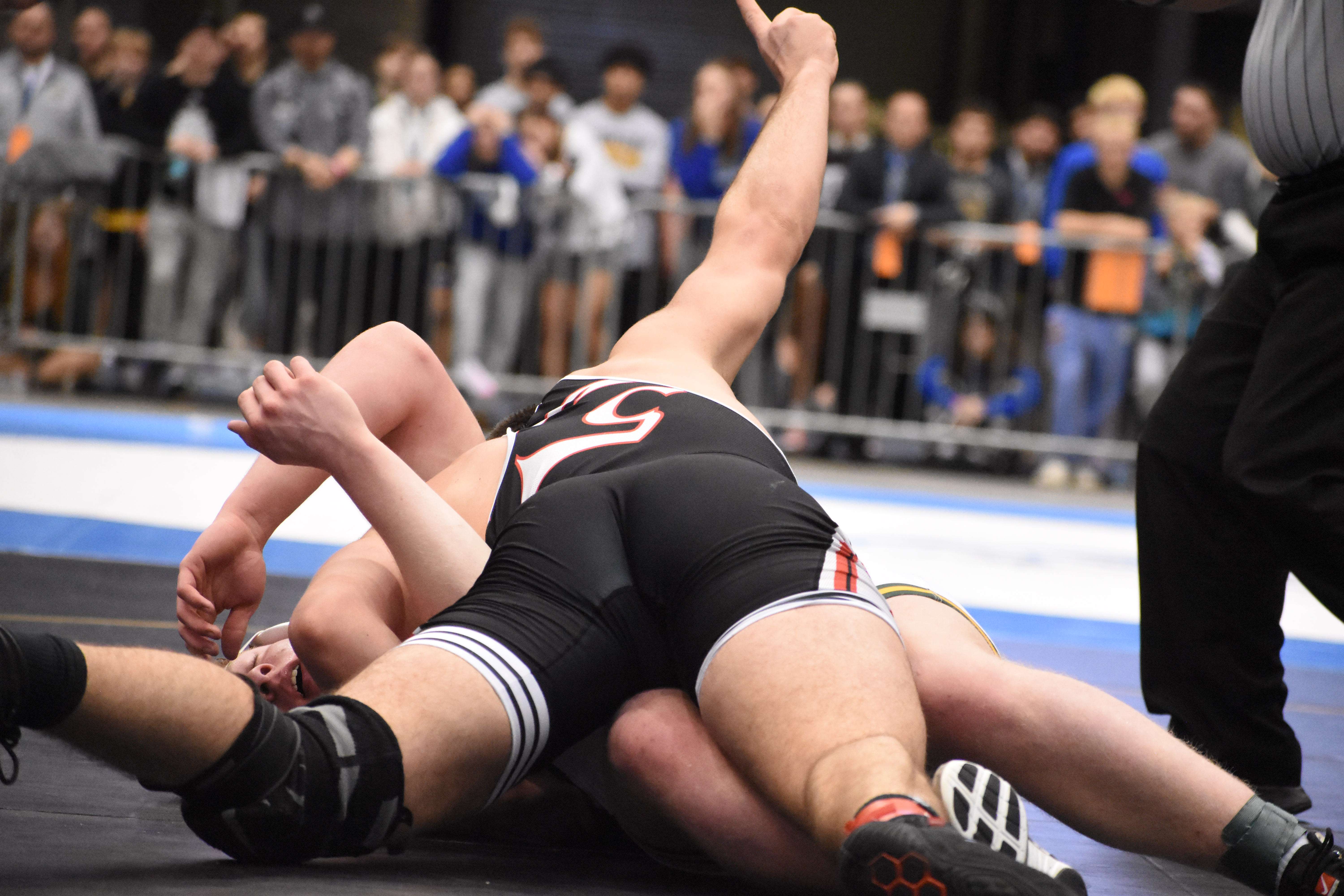 Kern holds up a No. 1 as he secures the final points and the first state championship of his prep career.