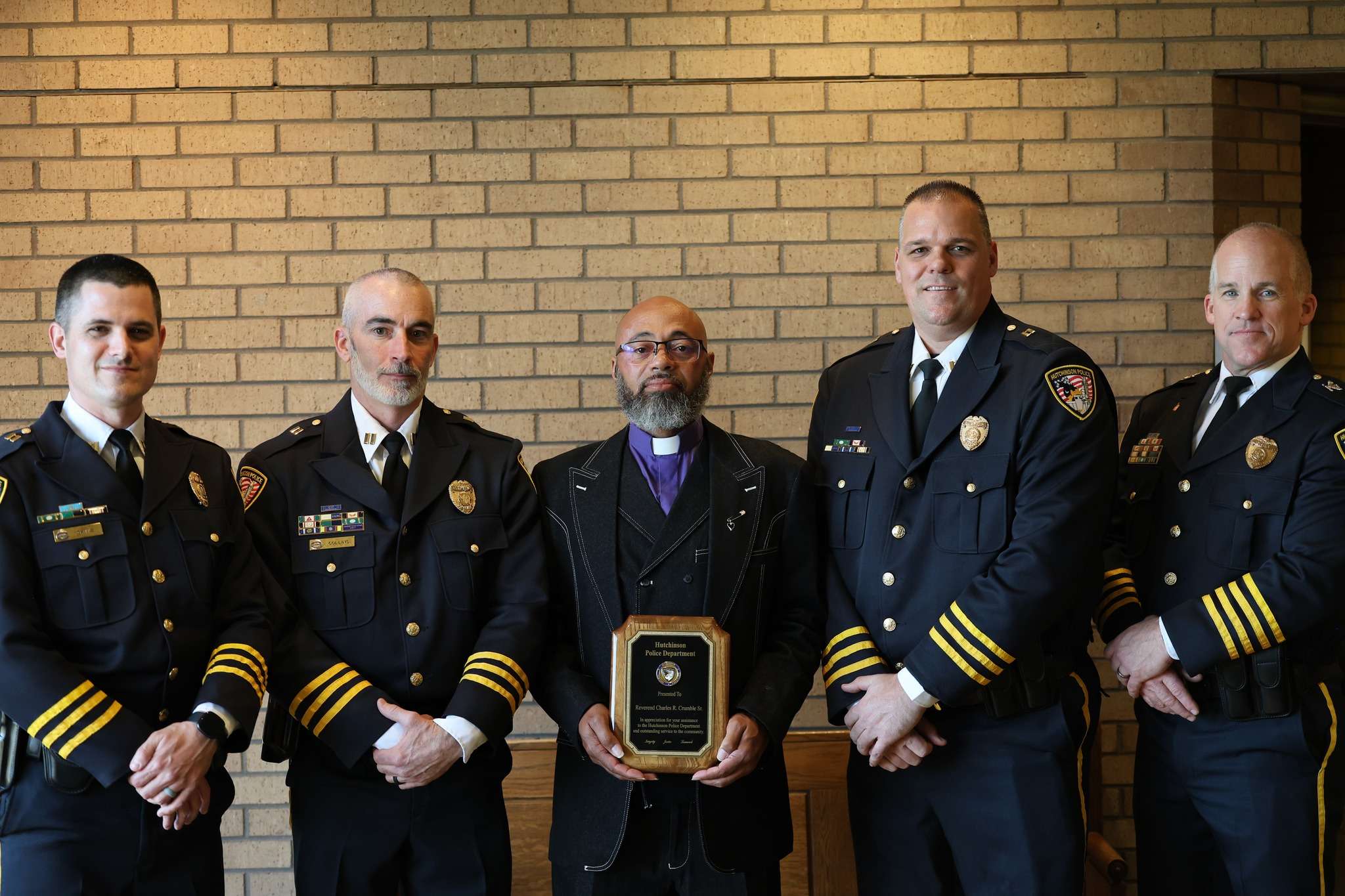 Capt. Dayton Gates, Capt. Michael Collins, Rev. Charles Crumble Sr., Capt. Dustin Loepp and Police Brice Burlie (Photo courtesy Hutchinson Police Department)