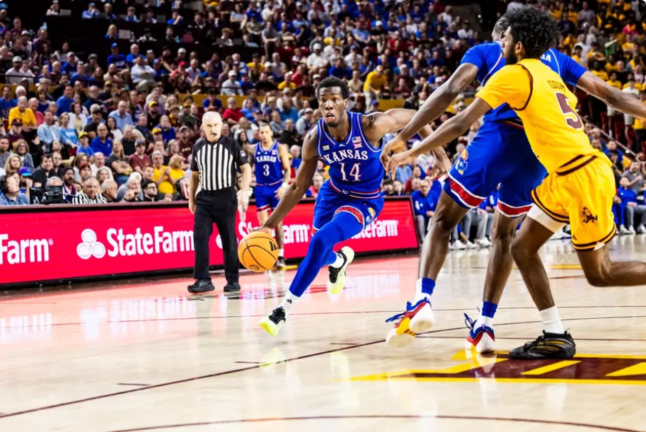 Kansas guard Melvin Council Jr. (14) drives towards the basket in the first half of their Big 12 basketball against Arizona State on Tuesday, March 3, 2026 in Tempe, Ariz. (Kansas Athletics photo)in Boulder, Colo. (AP Photo/David Zalubowski)
