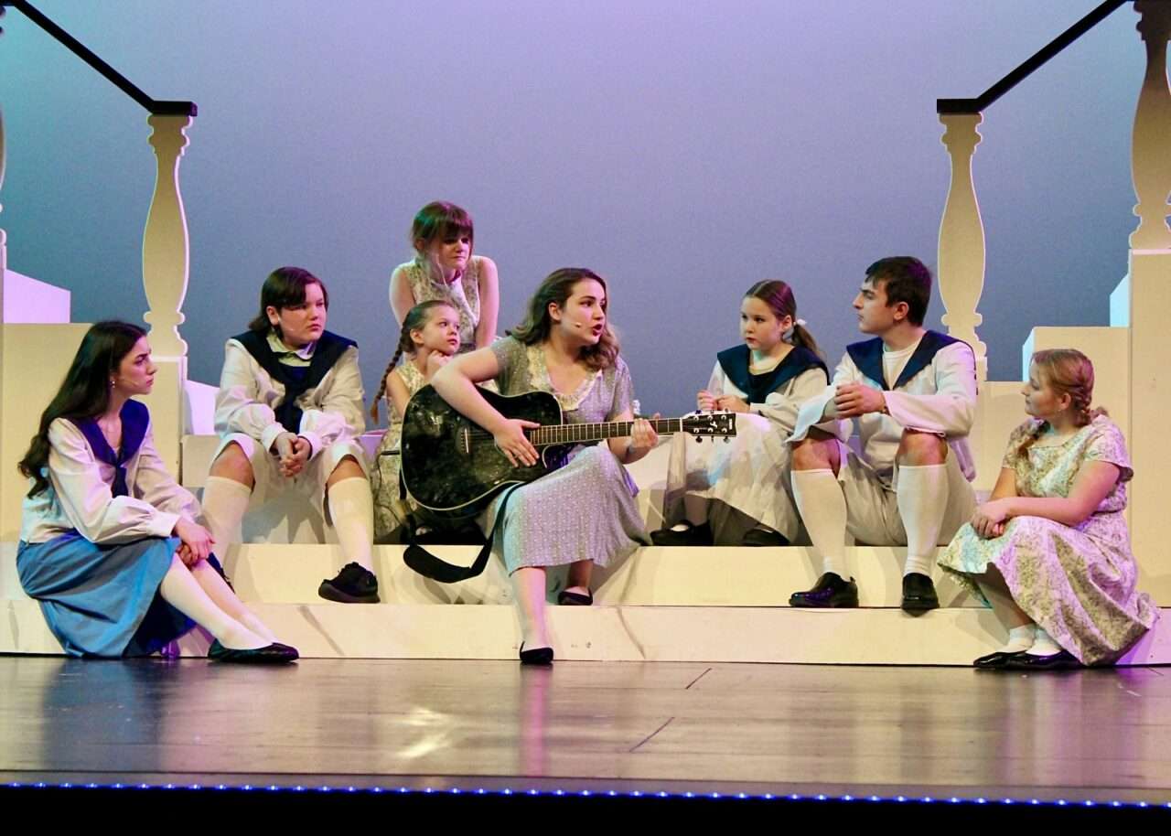 Maria Rainer, played by&nbsp;Johanna Jones, alongside the von Trapp family for Hays High School's "The Sound of Music" production. Photo by Tony Guerrero/Hays Post