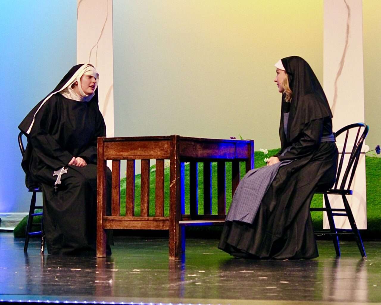 Maria Rainer (right) speaking with a nun. Photo by Tony Guerrero/Hays Post