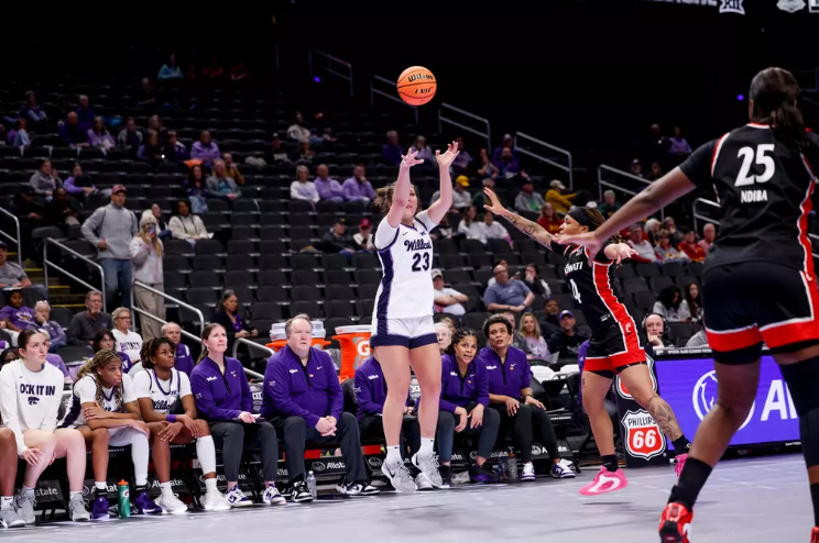 Jordan Speiser shoots of a Cinicinnati defender. - Photo courtesy K-State Athletic Communications