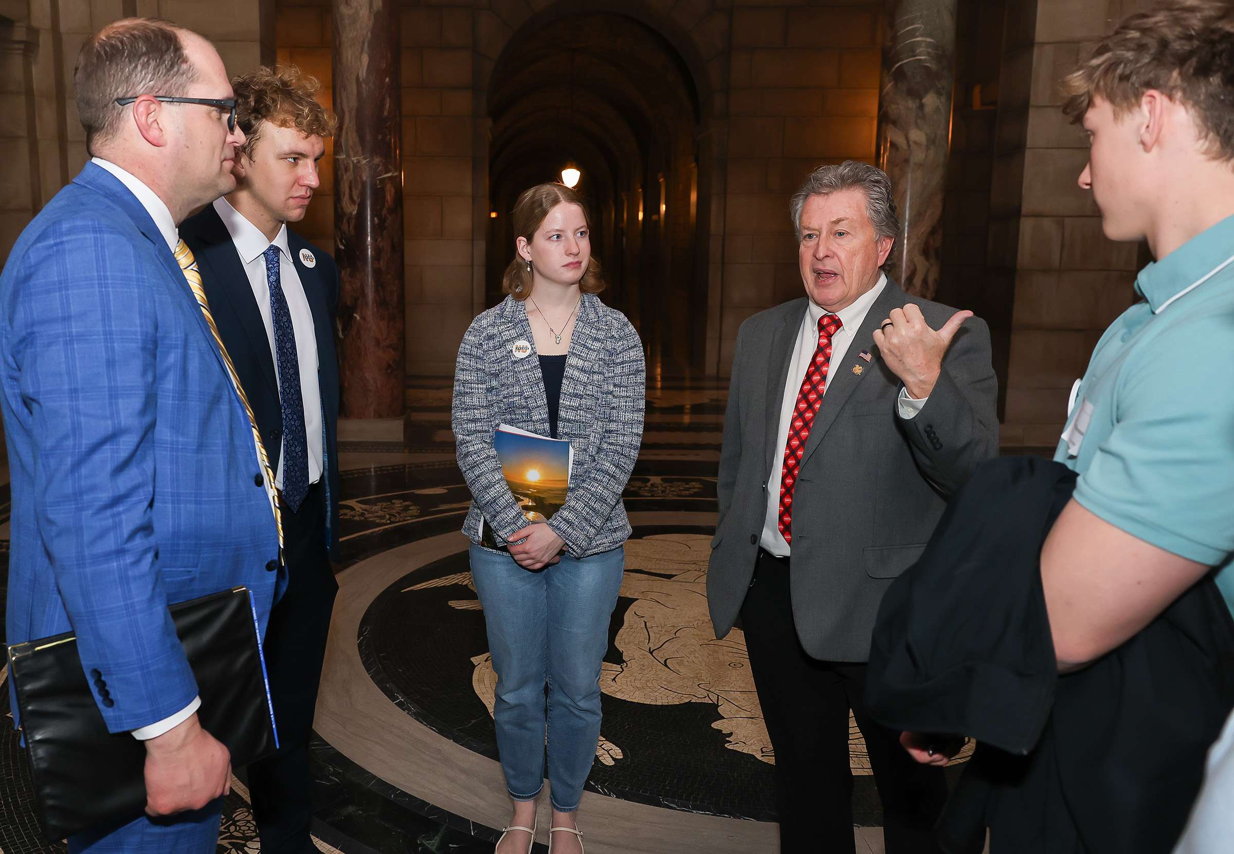 Sen. Stan Clouse of Kearney, second from right, meets with UNK students Wednesday during the annual “I Love NU” Day event at the State Capitol in Lincoln. (Photo by Erika Pritchard, UNK Communications)