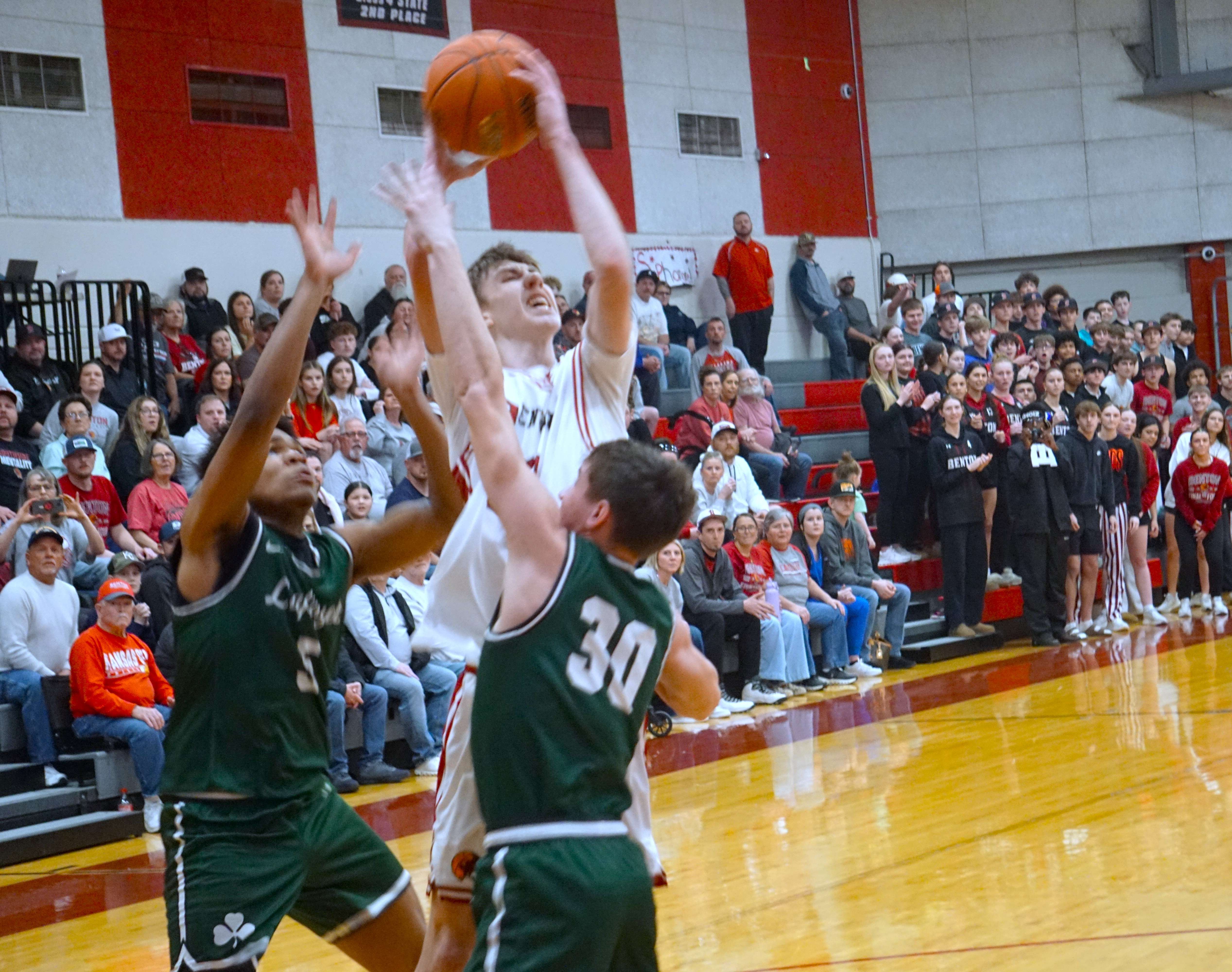 Lincoln Goodwin fights through two defenders for a basket/ Photo by Matt Pike