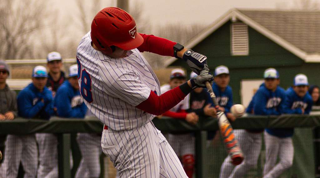 Finn Hochstein hits a two-run home run to center field in Game 1 of a doubleheader sweep of the Colby Trojans on Thursday at Fun Valley. The Dragons won 12-1 and 9-0. (Sydney Holzrichter/Blue Dragons Sports Information)