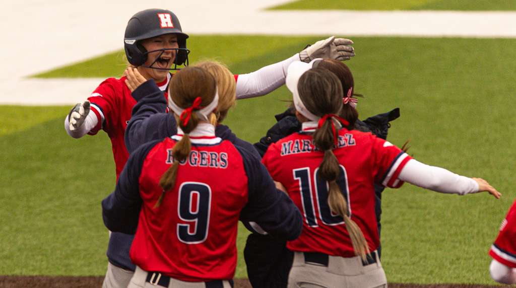 Blue Dragon teammates rush out to celebrate of Riley Dreher, who hit a walk-off single in a come-from-behind 4-3 win over Butler in Game 1 of a KJCCC doubleheader on Thursday at Fun Valley. (Sydney Holzrichter/Blue Dragon Sports Information)