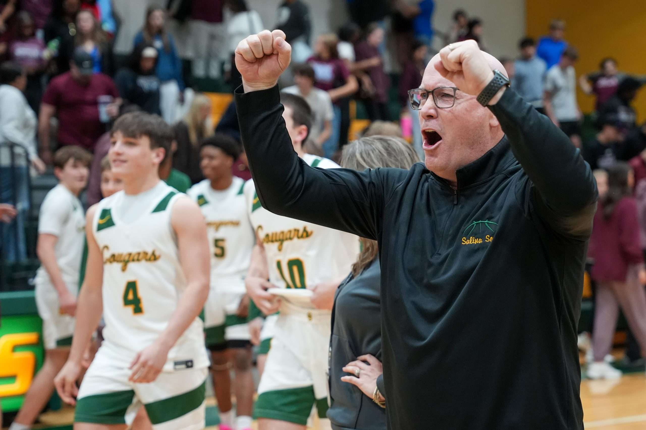 Coach Hooper celebrates a win over Central with his team. Photo courtesy of Ryan Stuart.