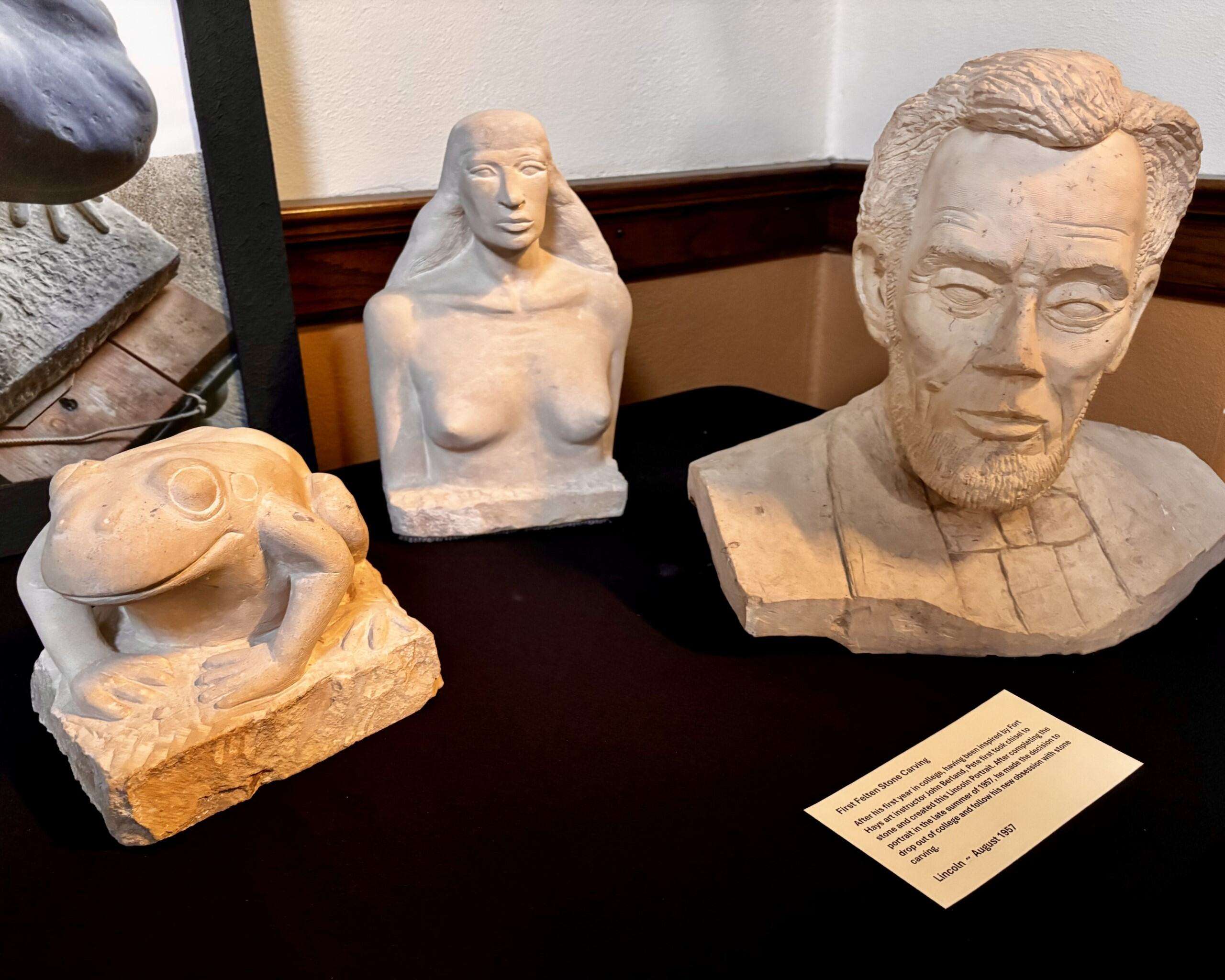 Several of Pete Felten's art pieces, including his first carving, an Abraham Lincoln portrait that he made in 1957. Photo by Tony Guerrero/Hays Post
