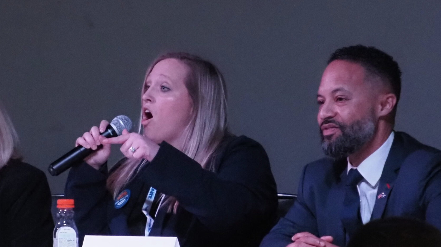 Democratic candidate Anne Parelkar states her point about Kansans needing better representation in Washington, D.C., at the Kansas Democratic Party’s annual convention March 8, 2026. (Photo by Morgan Chilson/Kansas Reflector)