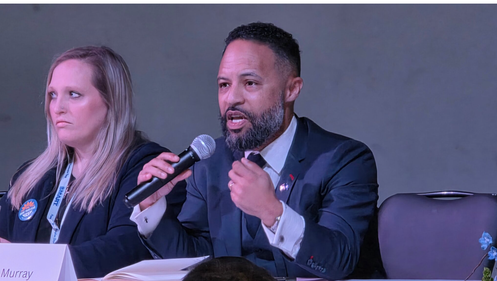 Democratic candidate Erik Murray shares his views on what Kansans want from their Washington politicians at the Kansas Democratic Party’s annual convention March 8, 2026. He is running for Sen. Roger Marshall’s seat. (Photo by Morgan Chilson/Kansas Reflector)