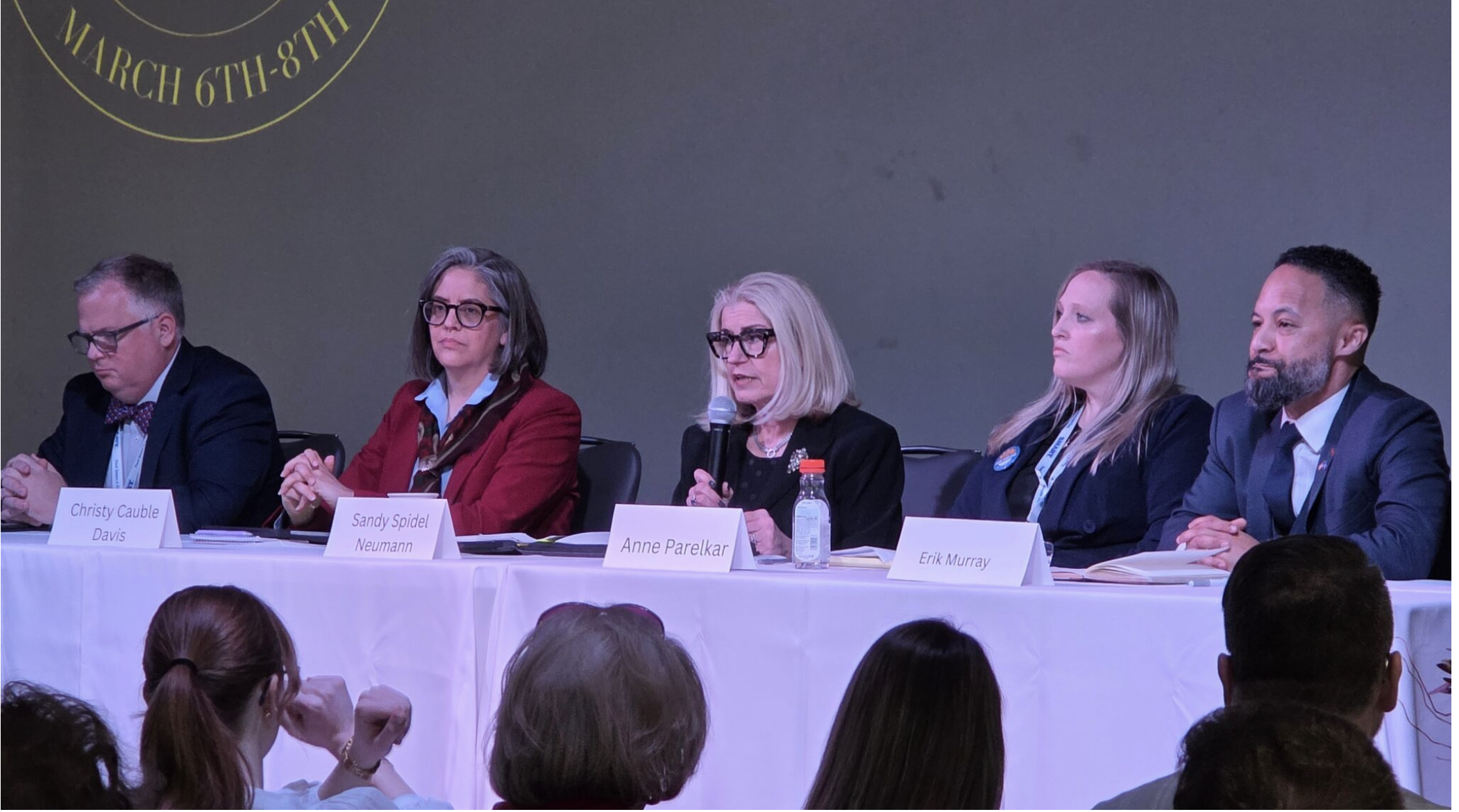  Five Democratic candidates running to flip U.S. Senator Roger Marshall’s seat blue spoke March 8, 2026, at the Kansas Democratic Party’s annual convention. From left, Jason Hart, Christy Cauble Davis, Sandy Spidel Neumann, Anne Parelkar and Erik Murray. (Photo by Morgan Chilson/Kansas Reflector)