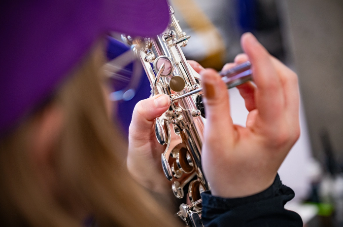 Kylee Gardner removes palm keys from an alto saxophone for pad replacement. (Photo courtesy K-State News and Communications)