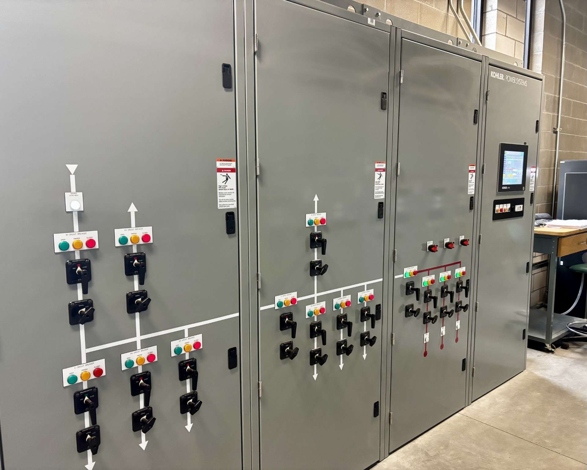 The controllers for the operation of the campus microgrid, which includes breakers, wind turbine and diesel generation controls. Photo by Tony Guerrero/Hays Post