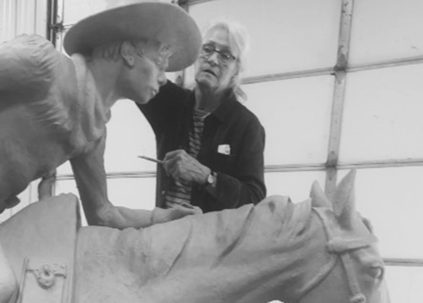 Nebraska Artist Linda Egle tooling the clay version of the bronze sculpture.