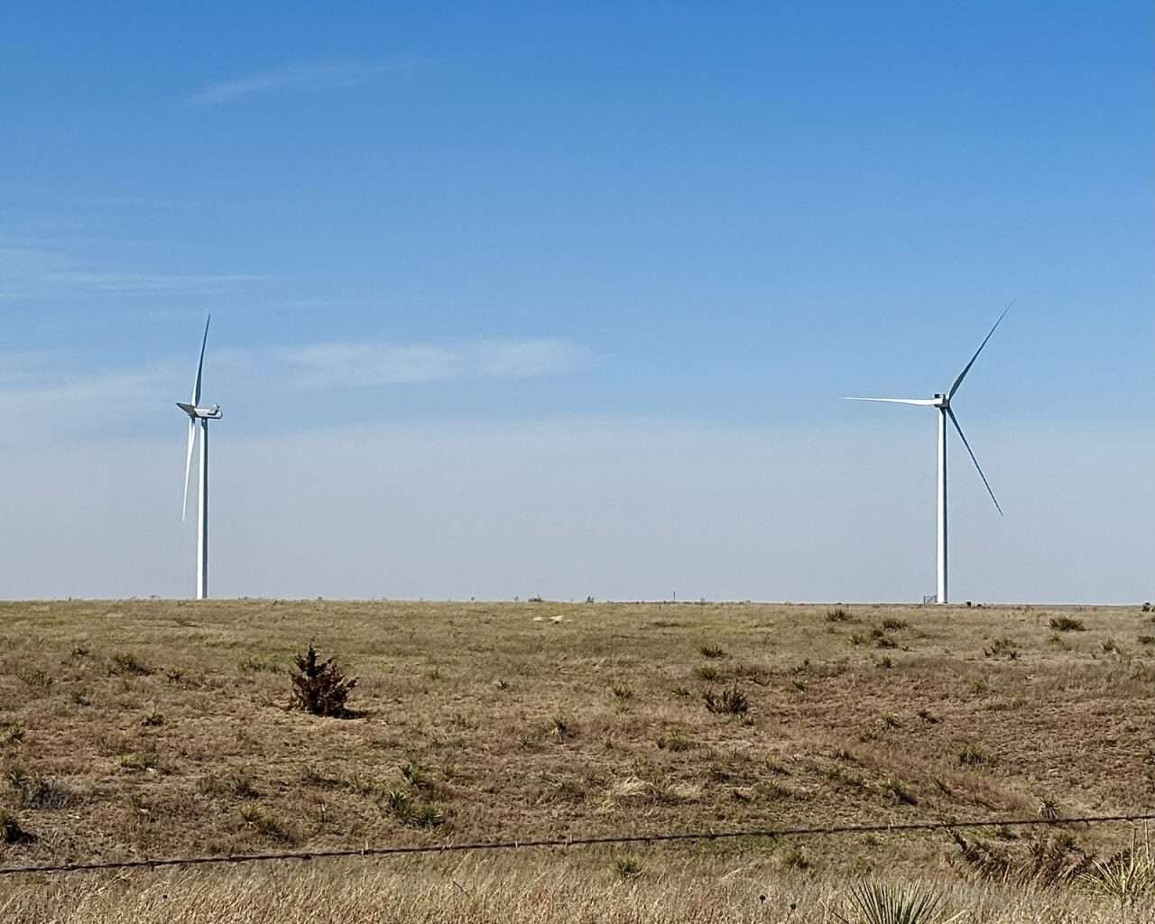 There are three and a half miles of underground cable buried between Fort Hays State University's two wind turbines, west of campus, and the Akers Energy Center. Photo by Tony Guerrero/Hays Post