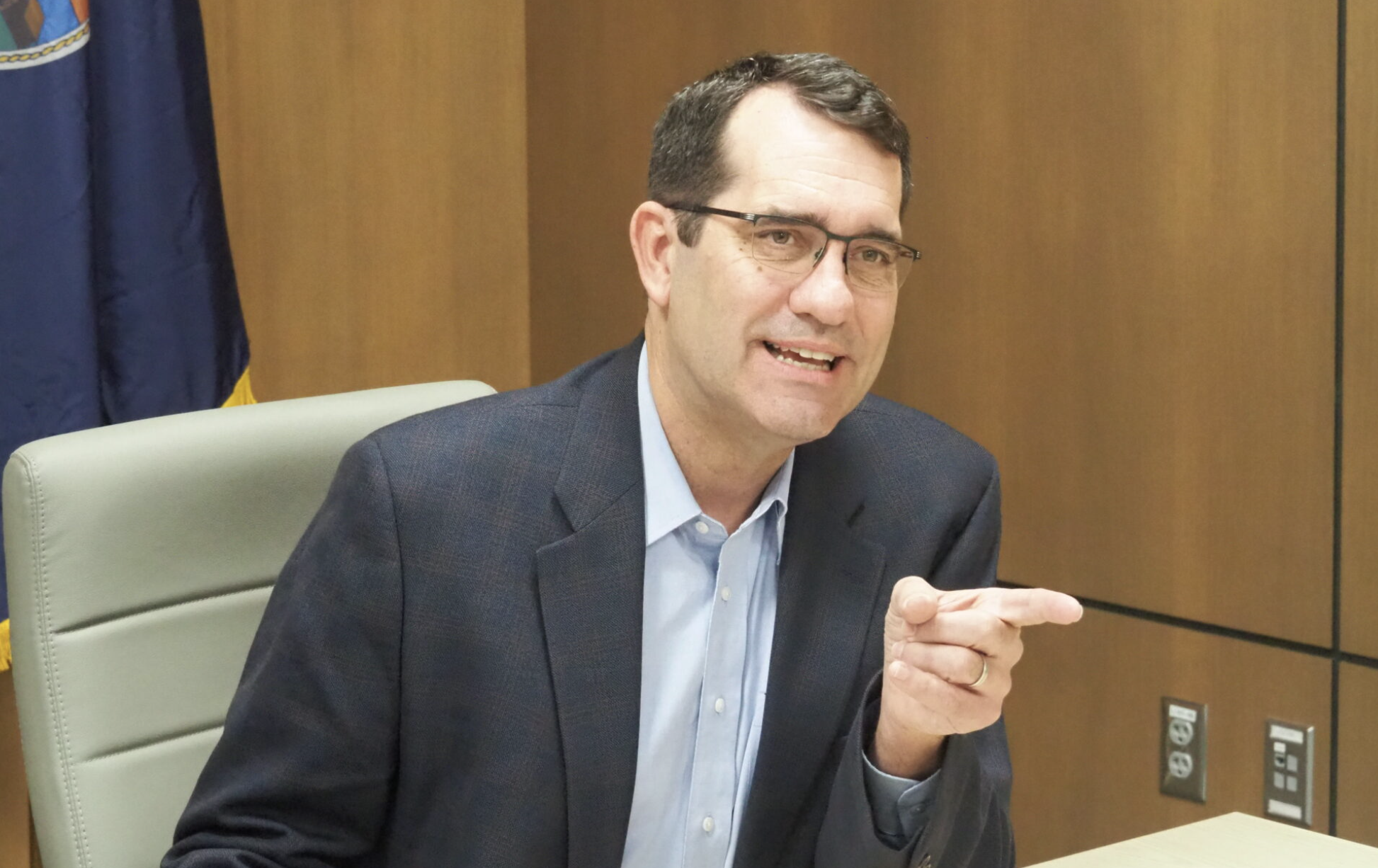  U.S. Rep. Derek Schmidt, R-Kansas, completes paperwork and pays the $1,700 filing fee March 12, 2026, at the Secretary of State’s Office to run for reelection in the 2nd District of eastern Kansas. (Photo by Tim Carpenter/Kansas Reflector)