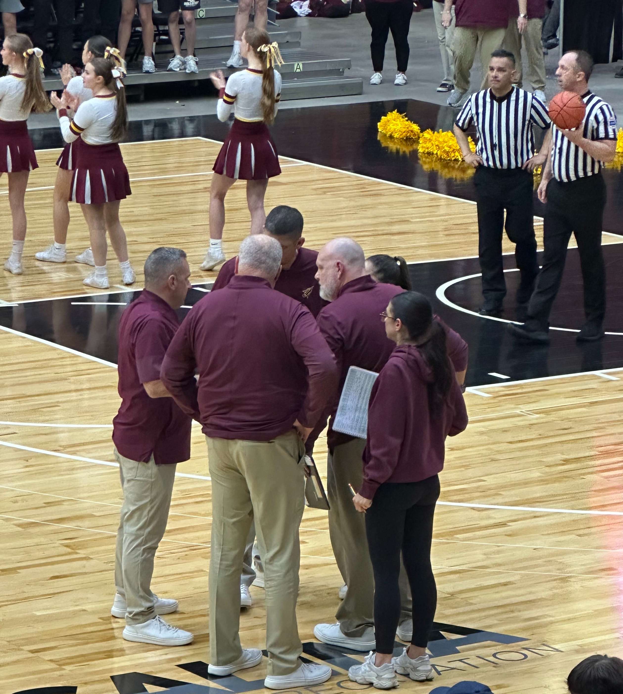 The Hays High coaching staff – with decades of combined experience – talks strategy in the final minutes of Wednesday’s state quarterfinal game. Photo by Diane Gasper-O’Brien