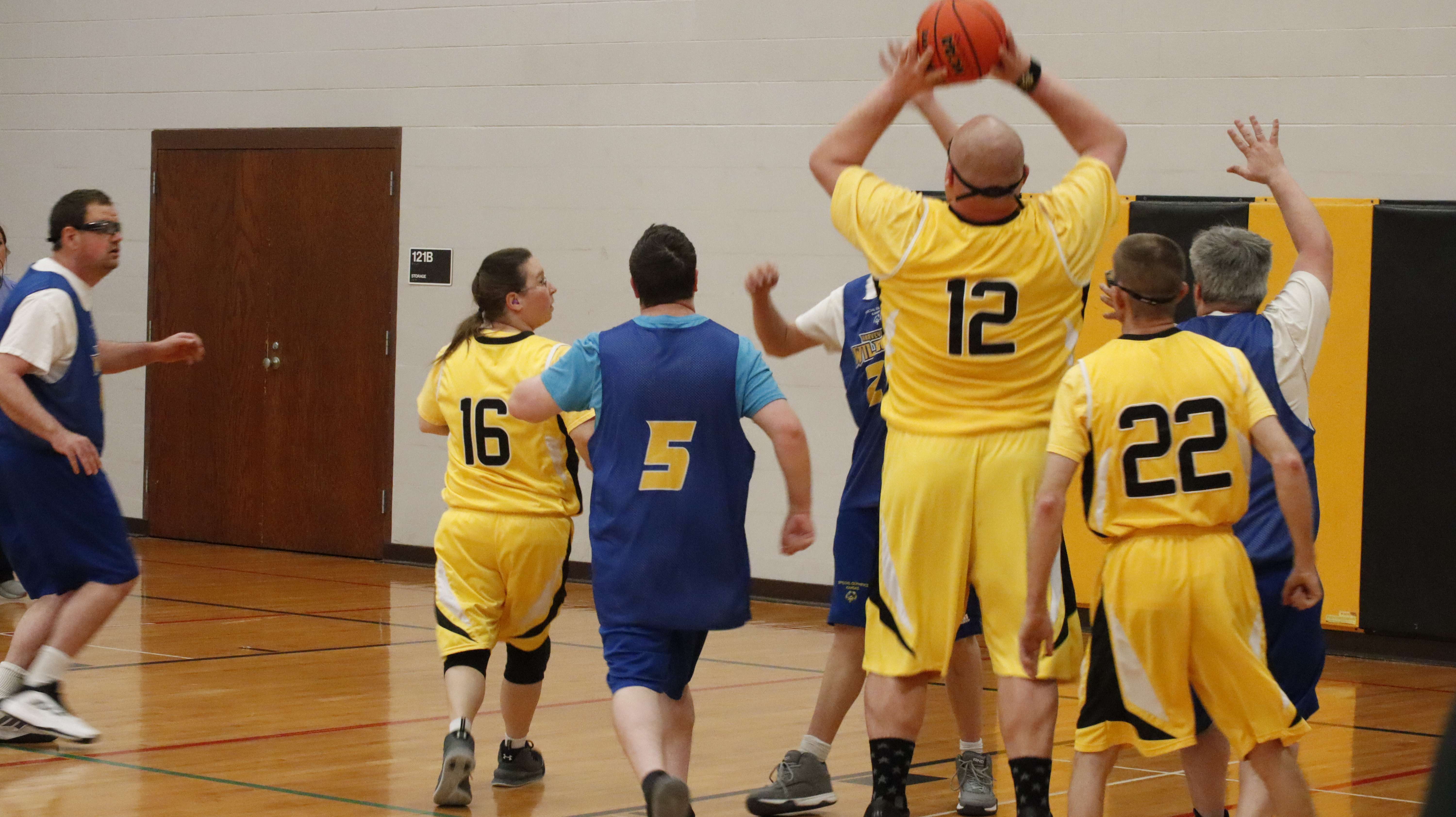 An athlete shooting a basket at the 2025 State Basketball and Cheerleading tournament in Hays. Photo courtesy of Special Olympics Kansas