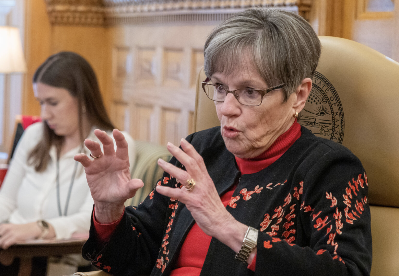  Gov. Laura Kelly, shown here in a Feb. 24, 2026, interview at the Statehouse in Topeka, signed a bill unanimously supported by the Kansas Legislature to allow issuance of a state identification card to homeless veterans without charging a fee and to designate Aug. 7 each year as a day to memorialize U.S. military recipients of the Purple Heart. (Photo by Sherman Smith/Kansas Reflector)
