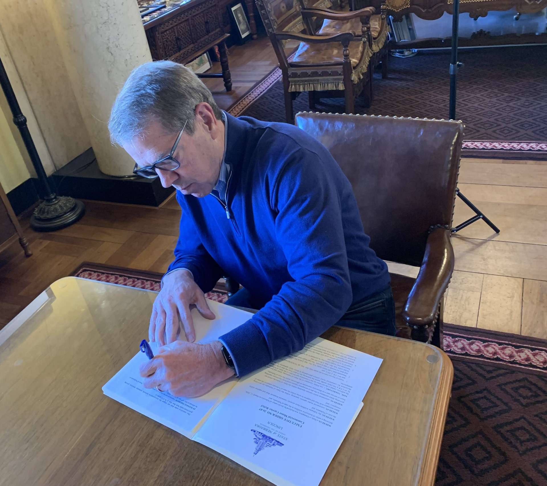 Governor Jim Pillen signing new executive order on March 16, 2026, (courtesy Governor's Office).