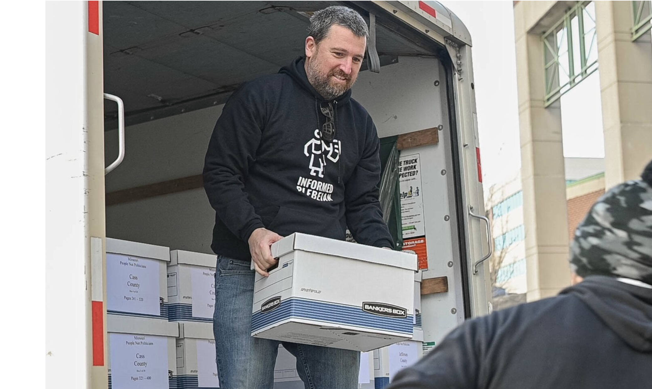  Richard von Glahn, campaign director of People Not Politicians, unloads boxes of petitions Dec. 9 at the Missouri Secretary of State's office. People Not Politicians was in court Tuesday asking for an order that all the signatures delivered on Dec. 9 be checked by local election authorities (photo submitted).