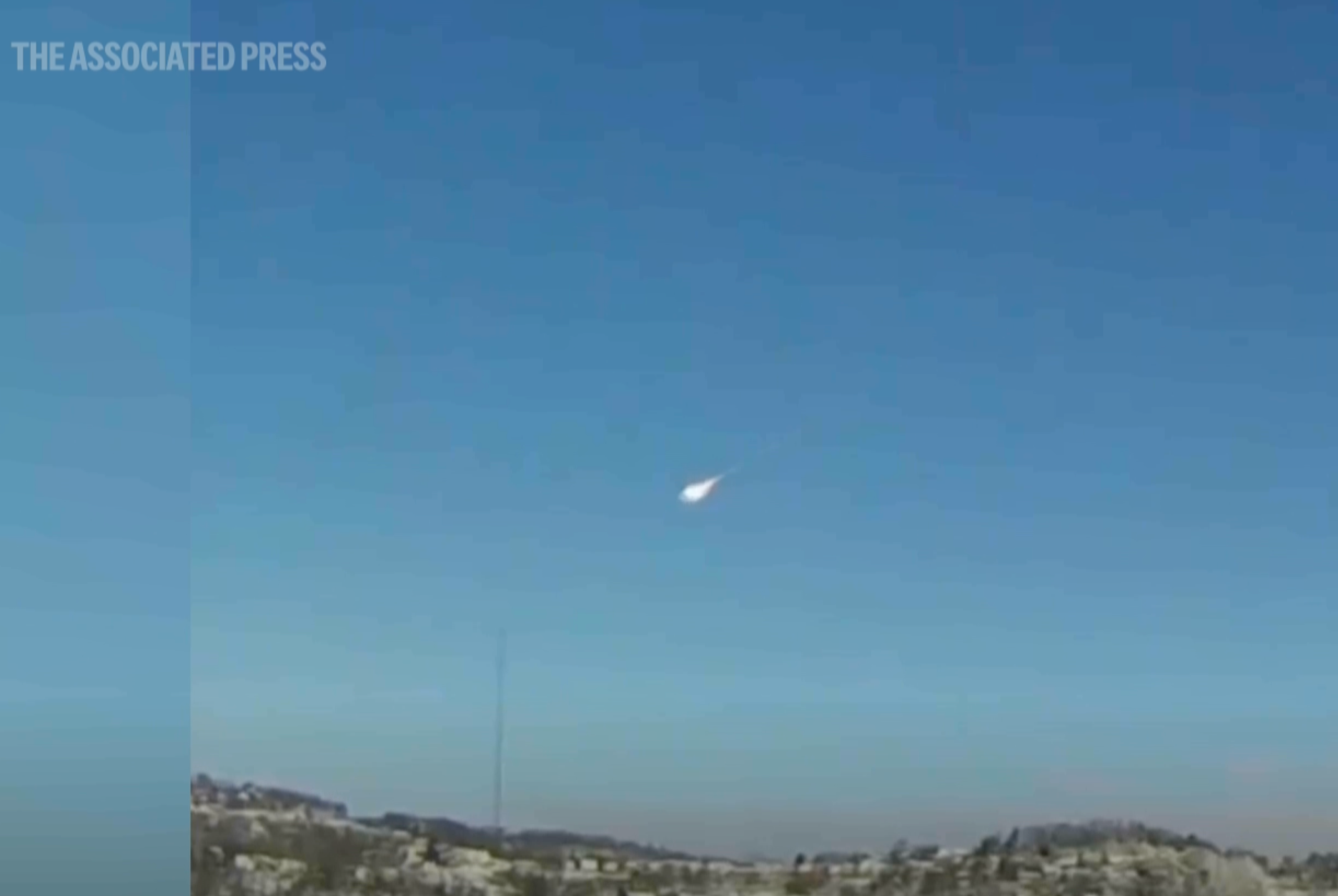 This image taken from video shows a suspected meteor falling through the sky in the greater Pittsburgh, Pa., area on Tuesday, March 17, 2026. (Jared Rackley via AP)