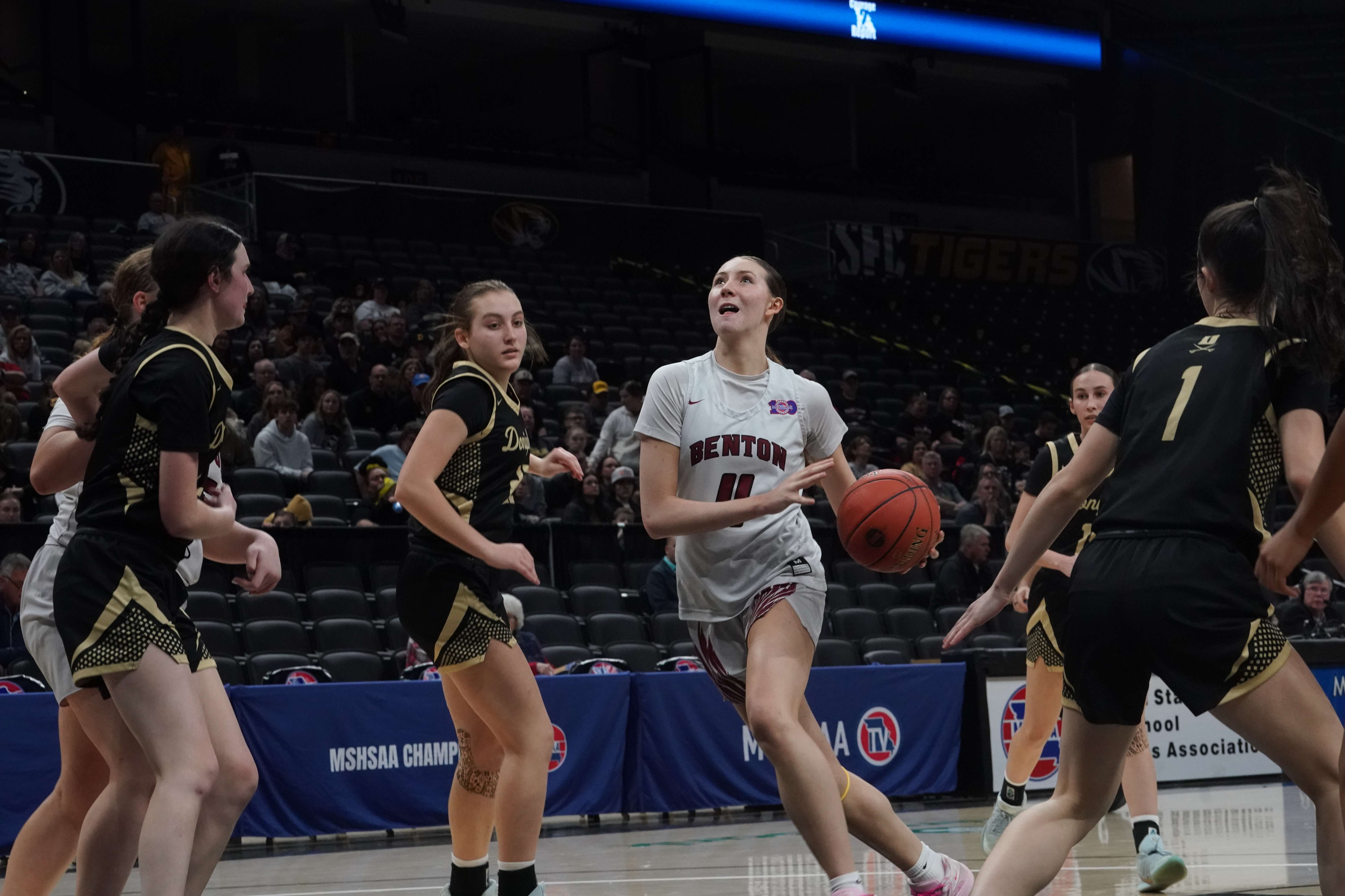 Jenna Cox drives into the lane against Doniphan.  Cox finished with eight points in Benton's 52-42 semifinal loss to the Donettes/ Photo courtesy of Clifton Grooms