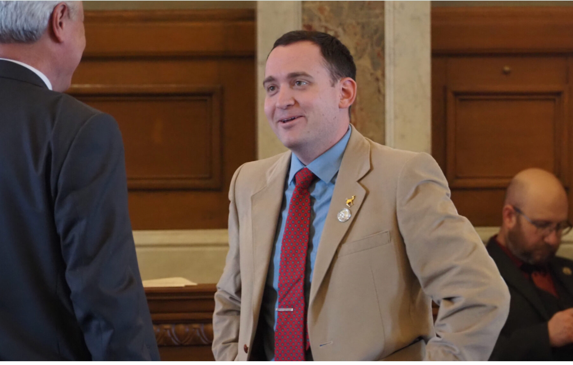  Rep. Blake Carpenter, a Derby Republican, endorses a property tax relief proposal that requires two-thirds majority approval in each chamber and a vote of the people. He appears on March 18, 2026, on the House floor In Topeka, Kansas. (Photo by Anna Kaminski/Kansas Reflector)