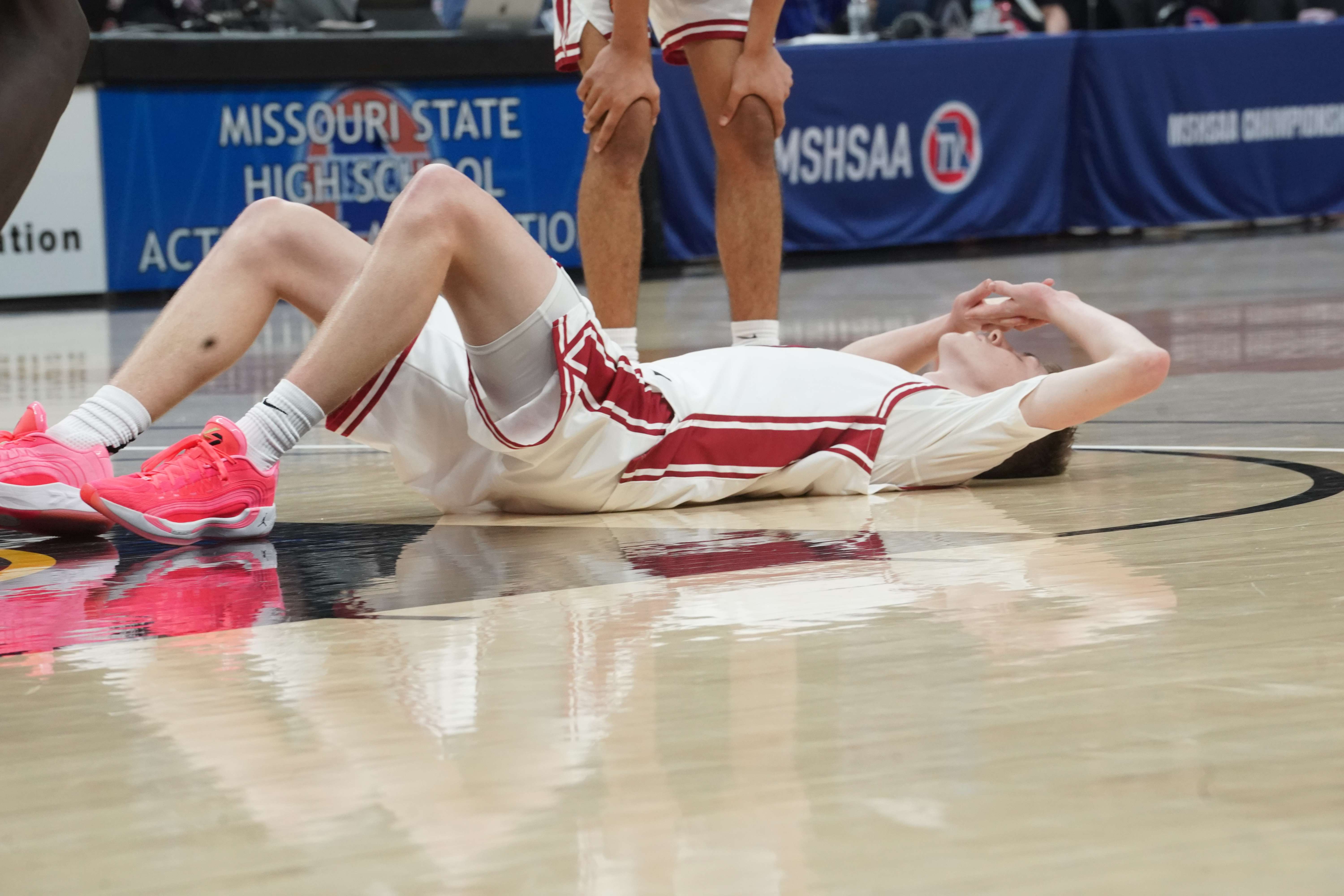 Lincoln Goodwin fell heartbroken to the court as his last second layup attempt went off the back rim and the Benton Cardinals fell to Clayton 54-52 in the MSHSAA Class 4 semifinals/ Photo courtesy of Clifton Grooms