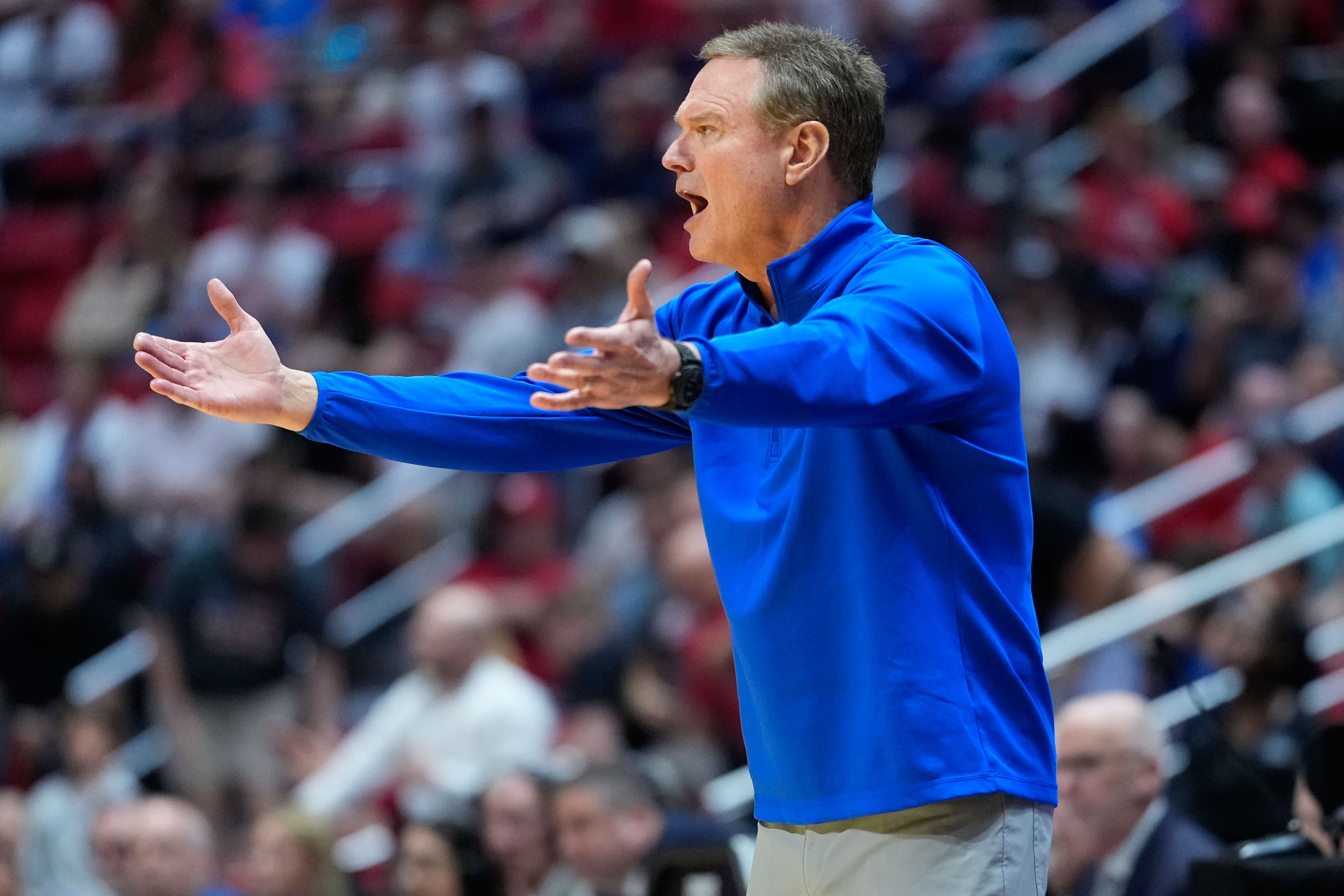 Kansas head coach Bill Self motions towards the court during the first half of a game between Kansas and St. John's in the second round of the NCAA college basketball tournament Sunday, March 22, 2026, in San Diego. (AP Photo/Mark J. Terrill)