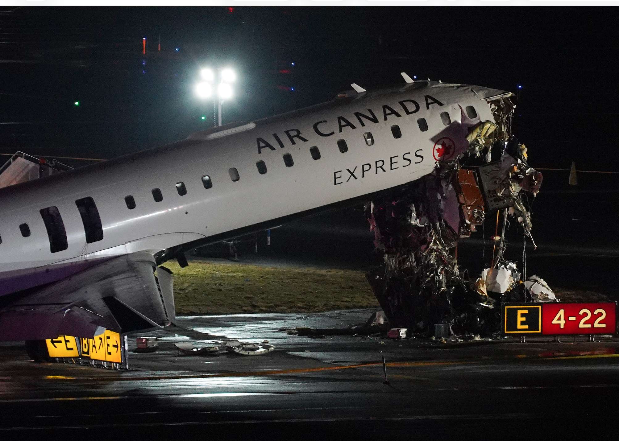 An Air Canada Jet sits on the runway at LaGuardia Airport, Monday, March 23, 2026, after colliding with a Port Authority aircraft rescue and firefighting vehicle after landing in New York. (AP Photo/Ryan Murphy)