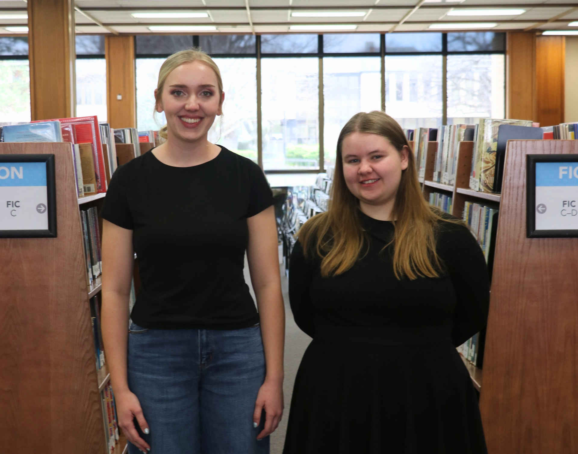 Madison Givens (left) and Kristen Kinion (right) each receive $1,500 scholarship from Friends of the Salina Public Library before heading to college - Salina Public Library