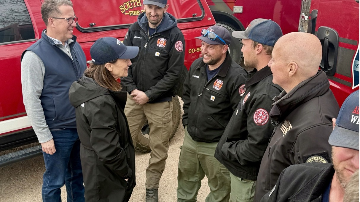Sen. Deb Fischer, Sen. Pette Ricketts, Rep. Adrian Smith speaking with fire crews in the mids of the western Nebraska Wildfire outbreak of March 2026. (Office of Senator Deb Fischer)