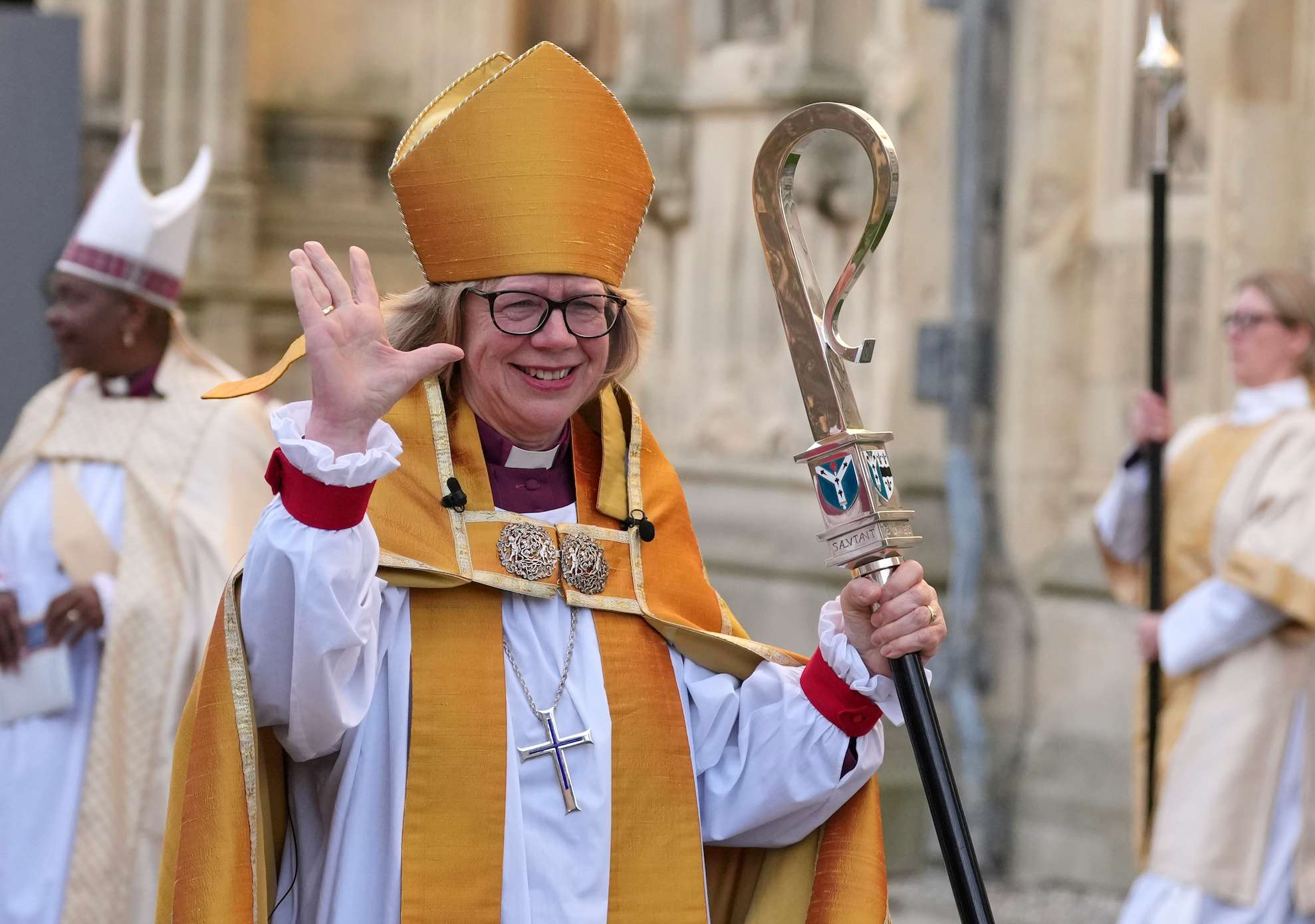 Sarah Mullally waves as she leaves after the Enthronement Ceremony installing her as archbishop of Canterbury in Canterbury, England, Wednesday, March 25, 2026, the first woman ever to lead the Church of England. (AP Photo/Alastair Grant)