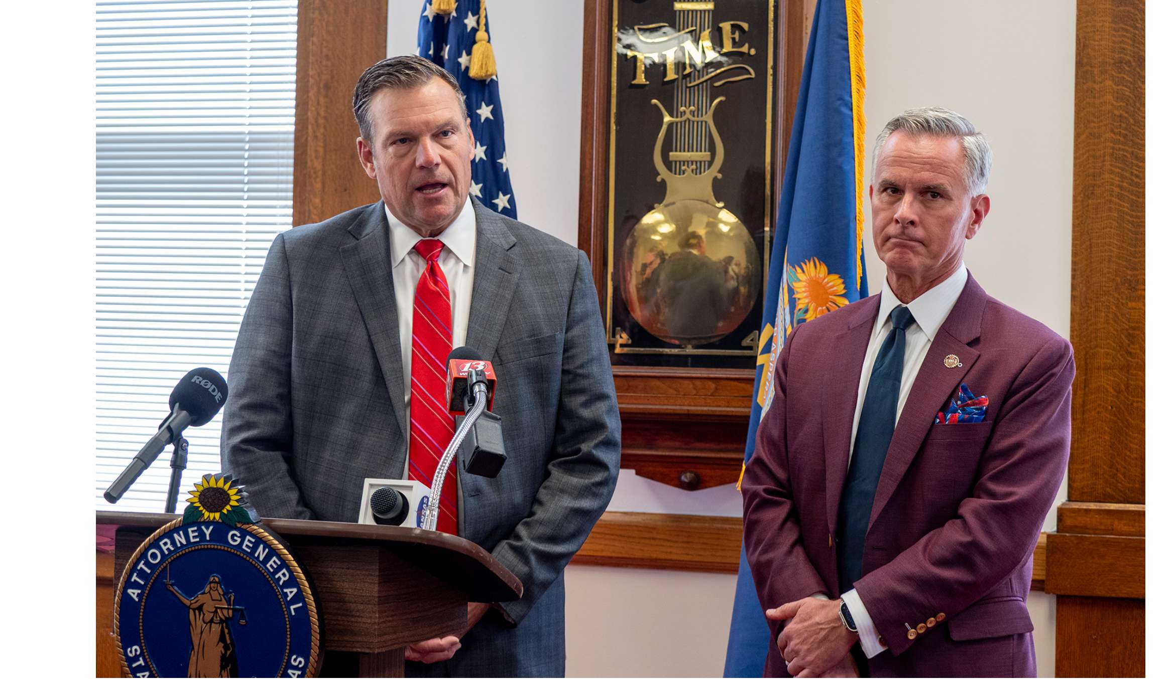  Kansas Bureau of Investigation director Tony Mattivi, right, and Attorney General Kris Kobach talk to reporters during an Oct. 1, 2025, news conference on illegal retail sales of marijuana and THC products. (Photo by Sherman Smith/Kansas Reflector)