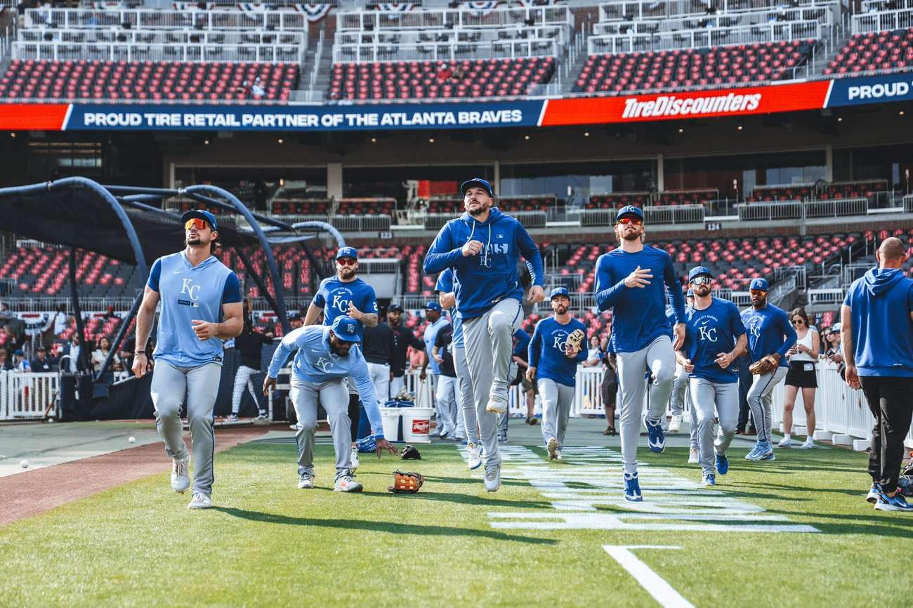 Royals players including Vinnie Pasquantino and Bobby Witt Jr warm up prior to first pitch against the Atlanta Braves on Opening Day/ Photo courtesy of the Royals on X