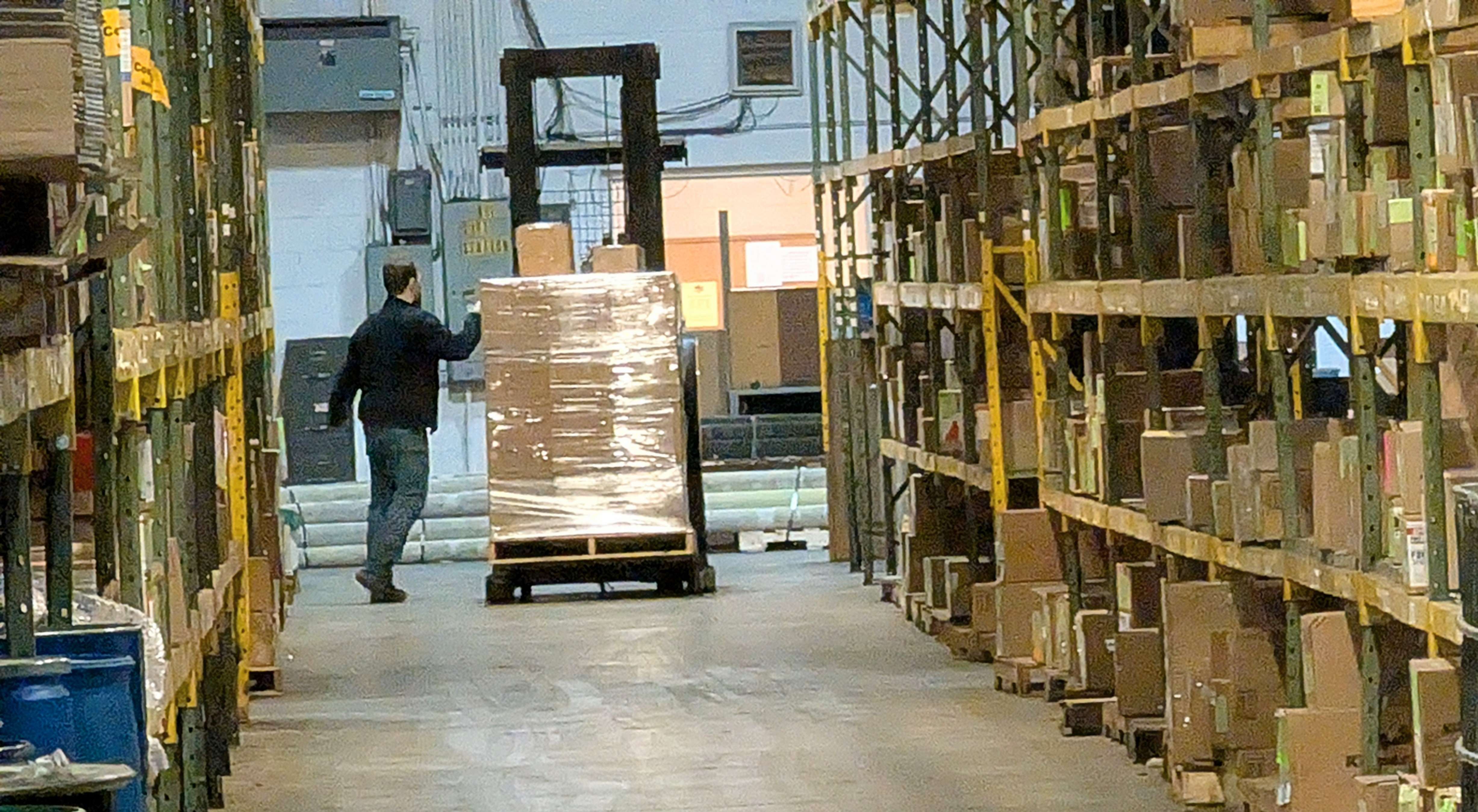 A Fuller Industries Inc. employee checks to see if a forklift load is secure at the plant this week. This is part of the company’s ongoing safety efforts.