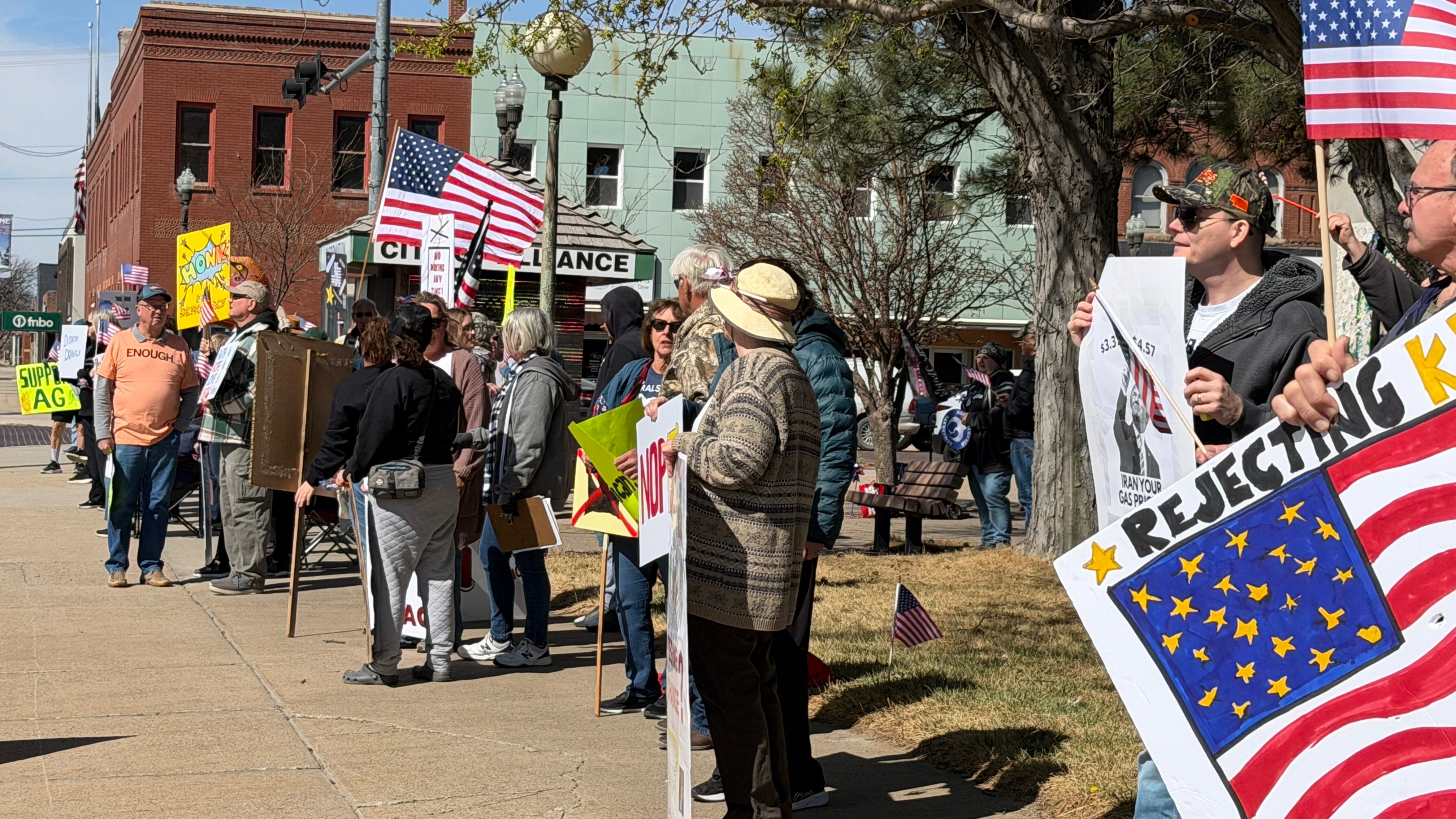 Protesters gather in a crowded mini-park at 3rd Street and Box Butte Avenue in the morning of Saturday, March 29, 2026 in Alliance as part of a nationwide NO KINGS rally. The protest took a stance against government decision-making and current leadership (photo courtesy Mary Wernke).