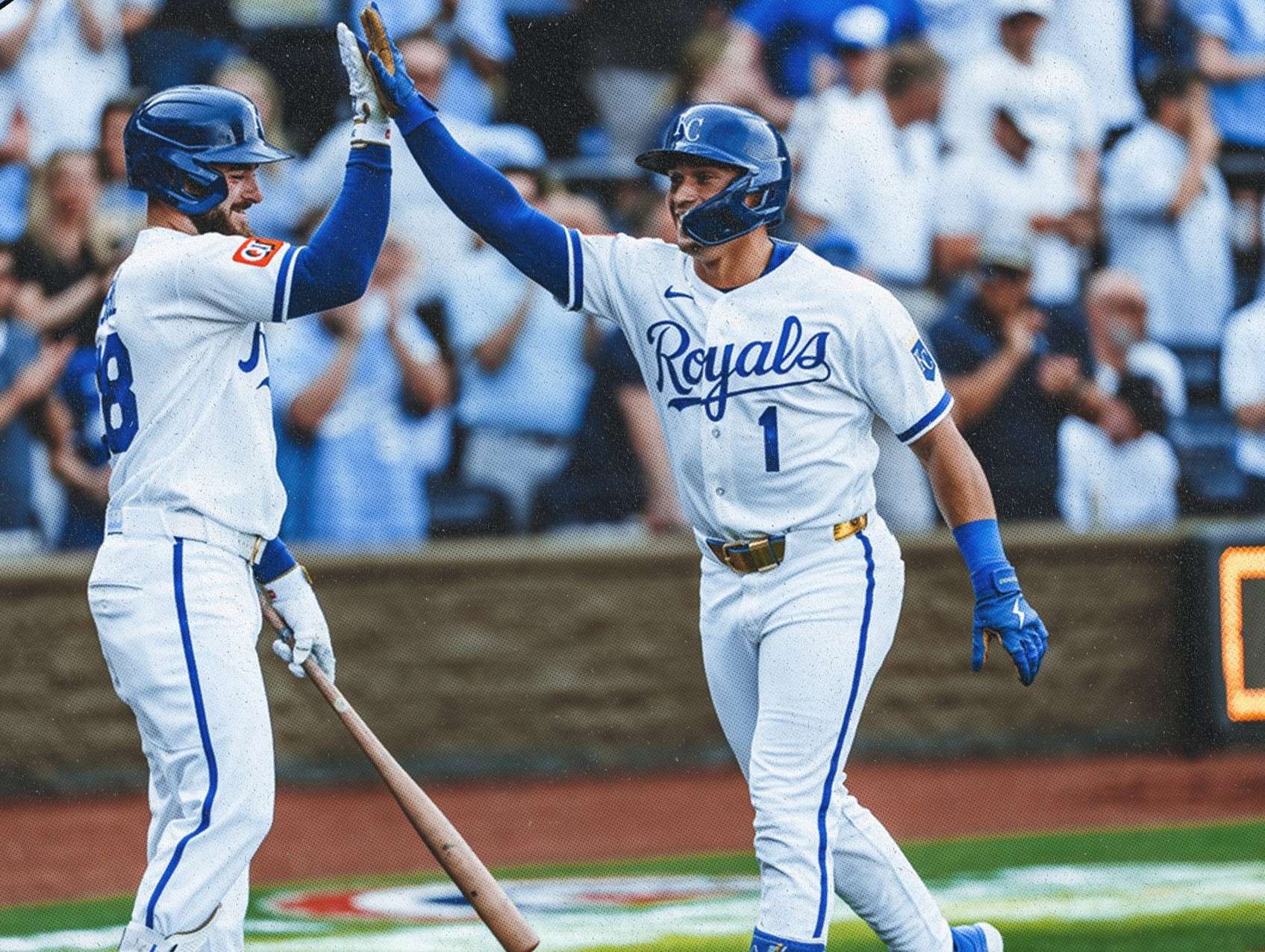 Kyle Isbel high fives new Royal Isaac Collins after his solo home run extended Kansas City's lead over the Minnesota Twins to 3-1/ Photo courtesy of the Royals on X