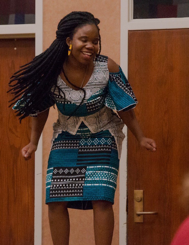 Emmanuella Tchona of the Republic of Benin, dances during the fashion show for the International Dinner at Chadron State College Feb. 26, 2022. (Photo by Abigail Swanson/Chadron State College)