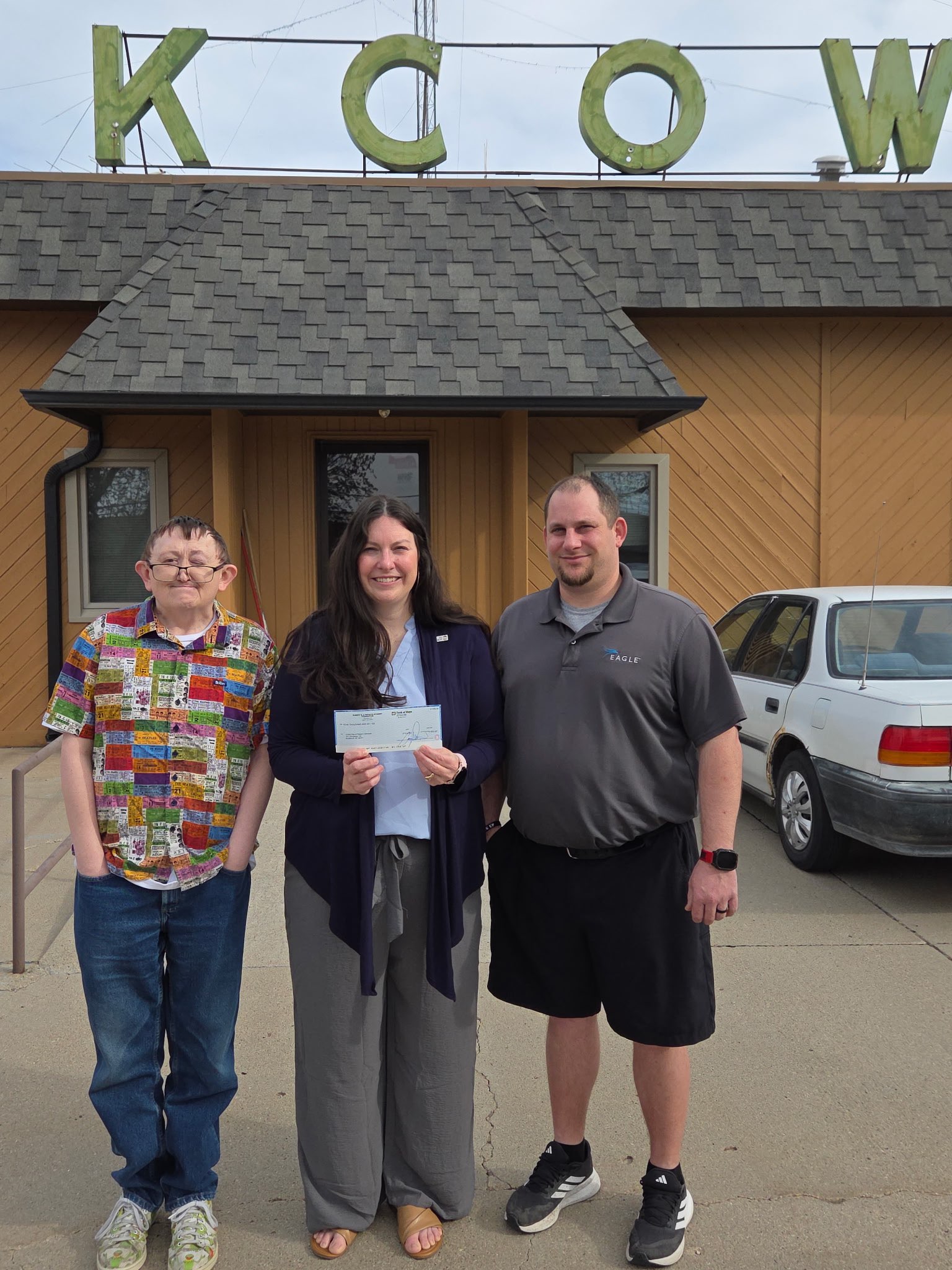 A $5,000 check from the Schmidt Foundation was presented to Executive Director of United Way of Western Nebraska, Karen Benzel, on Monday, March 30, 2026 outside of KCOW radio station in Alliance, Neb. (from left to right: Jason Wentworth, Karen Benzel, Aaron Wiley, photo courtesy Olivia Hasenauer).