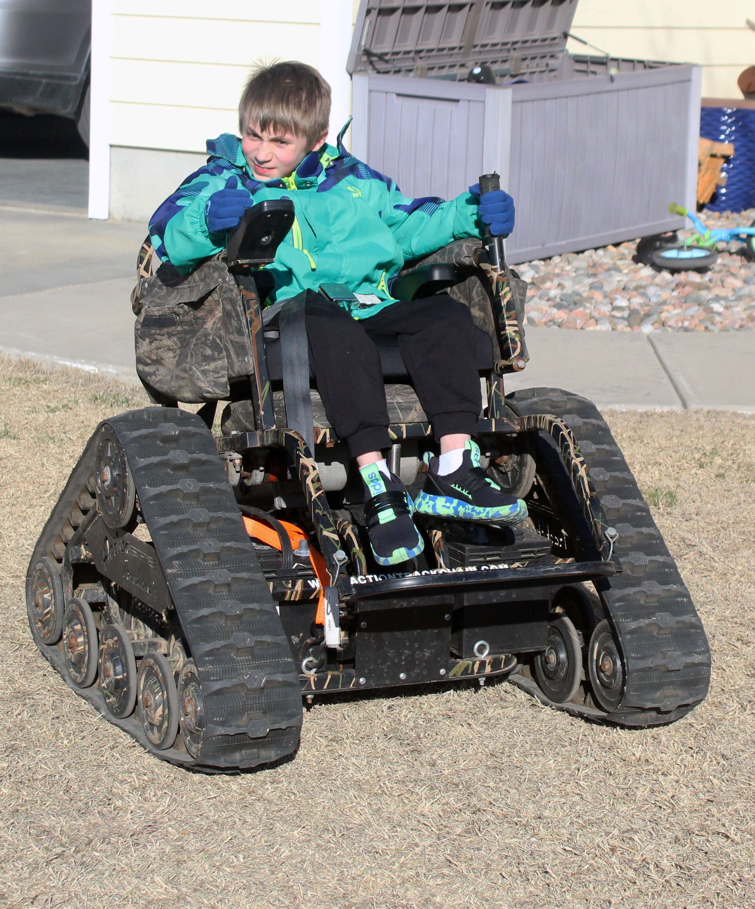 Brody on his trakchair at his home in Victoria. The chair, provided by the nonprofit Mile Monsters, allows him greater mobility and independence. Photo by Cristina Janney/Hays Post