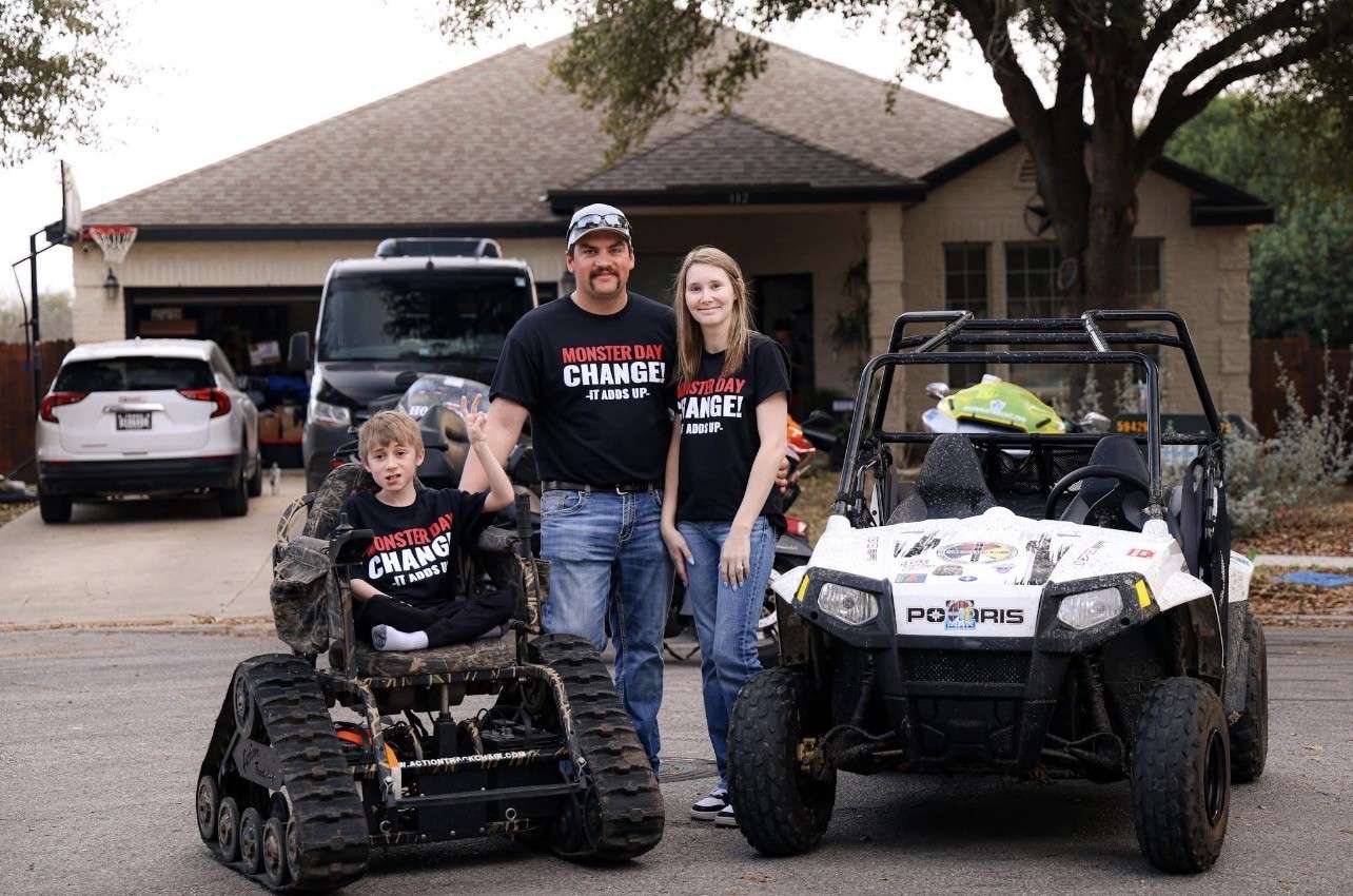 Brody, his step-dad, Nathan, and his mom, Kyleigh, with hsi trakchair and side-by-side, both purchased by Mile Monsters. Courtesy photo