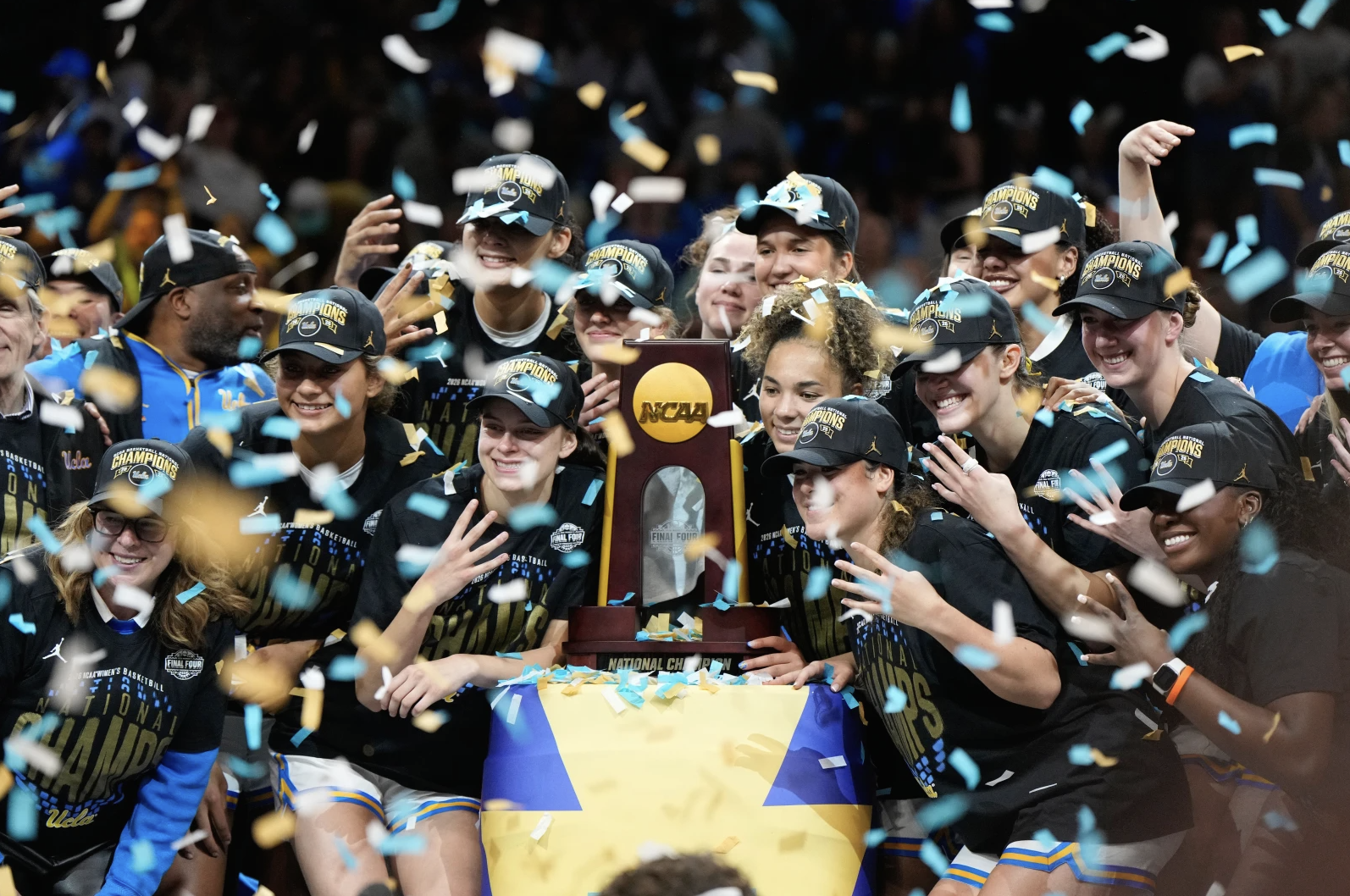 UCLA players celebrate after defeating South Carolina in the womenâs National Championship Final Four NCAA college basketball tournament game, Sunday, April 5, 2026, in Phoenix. (AP Photo/Ross D. Franklin)