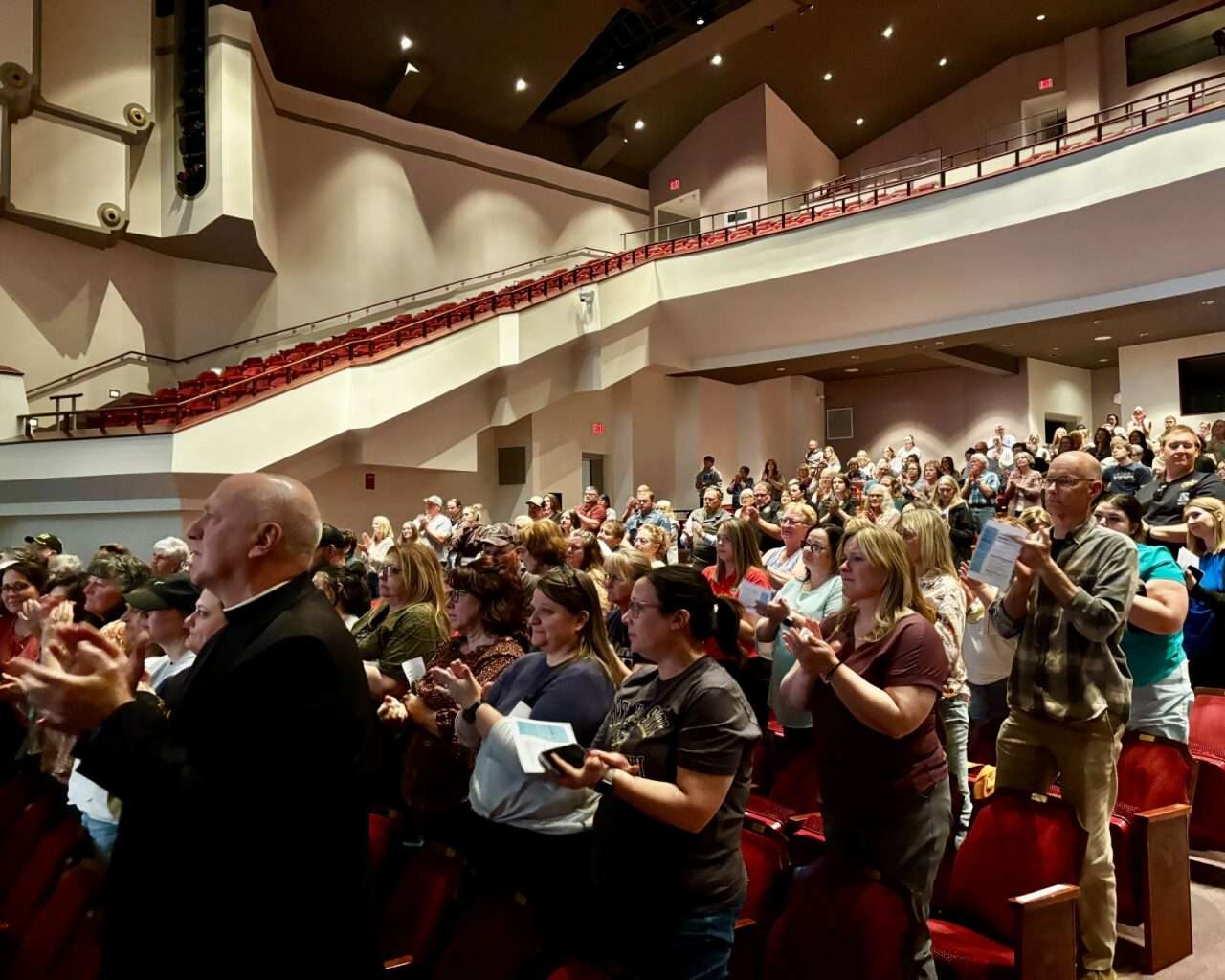 Stacie Edgett-Minson receiving applause after sharing her experience surviving the I-70 rapist with a panel of law enforcement. Photo by Tony Guerrero/Hays Post