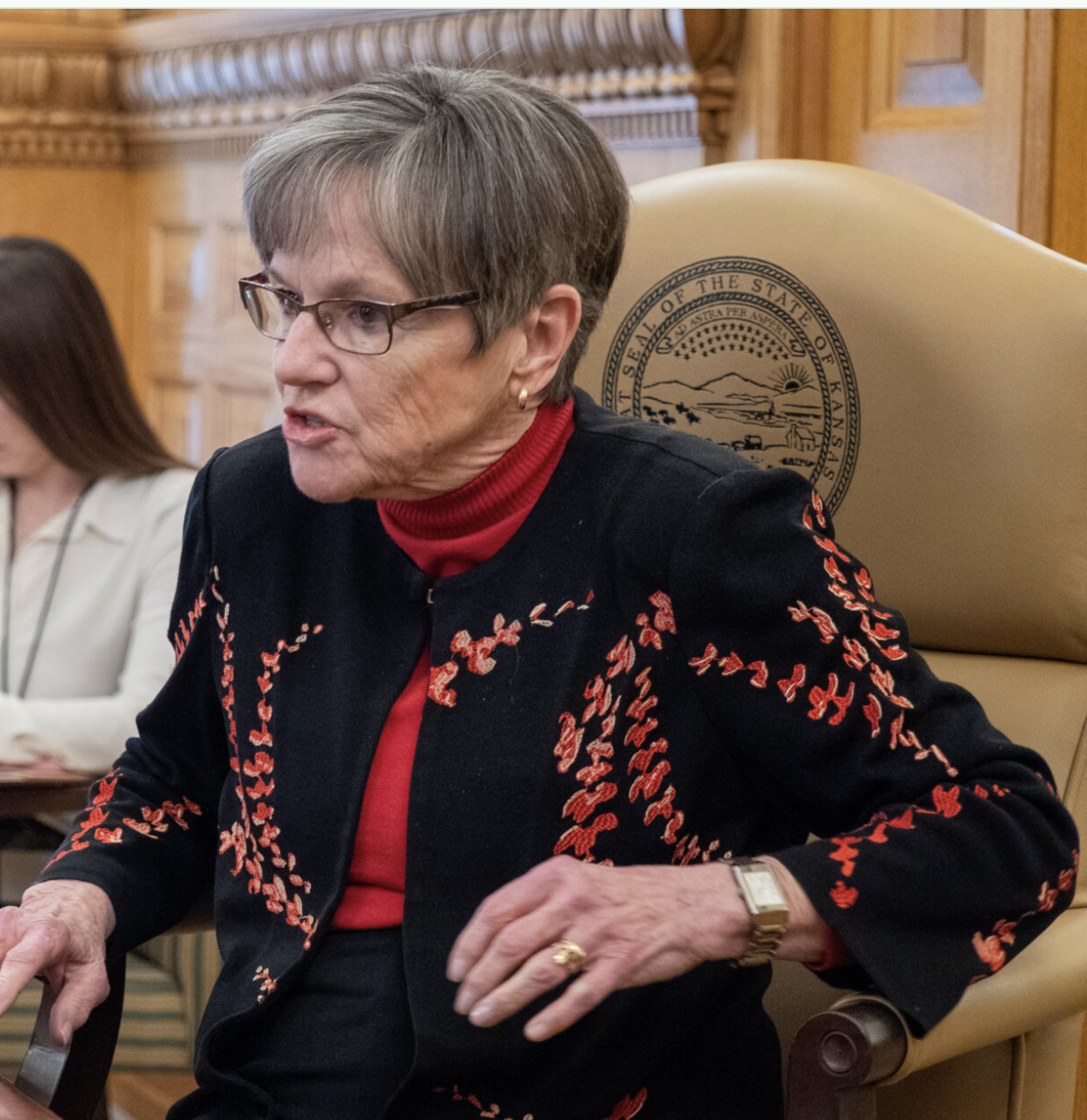  Gov. Laura Kelly signed bipartisan bills into law on April 7, 2026, including one that voids disciplinary actions at the Kansas Board of Nursing back to 2005. Other bills included one encouraging school districts to participate in federal programs that feed children breakfast and lunch and one that sets up a process for adults who need help managing their affairs to contract with other adults for support. (Photo by Sherman Smith/Kansas Reflector)