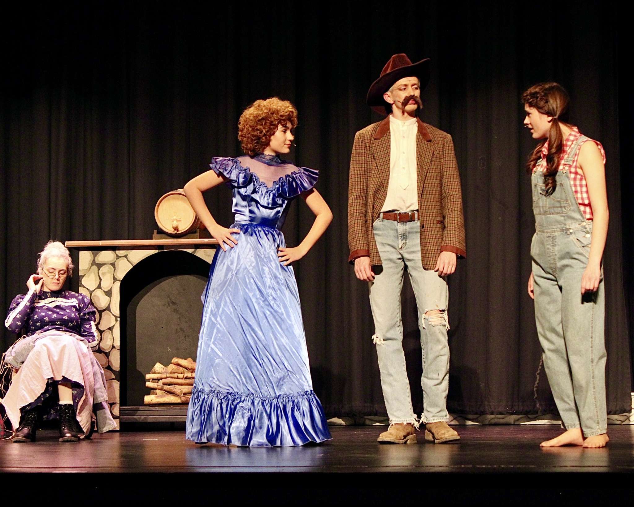 Cast members for Thomas More Prep-Marian's "The Beverly Hillbillies" in the Clampett family cabin. Photo by Tony Guerrero/Hays Post